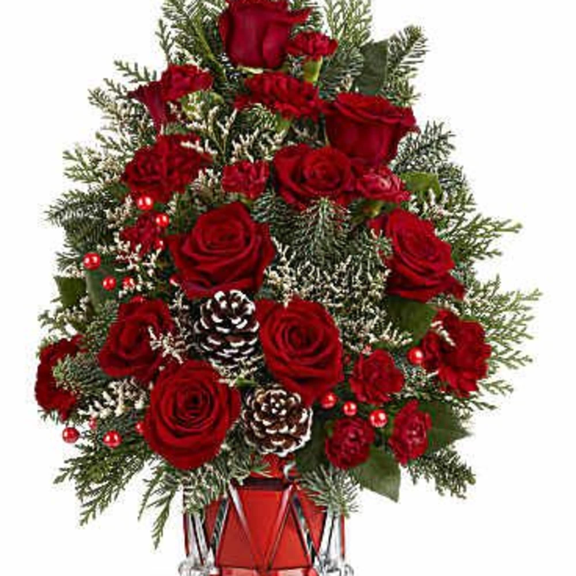 Teleflora&#039;s Yuletide Sparkle Tree is a festive floral Christmas tree made of