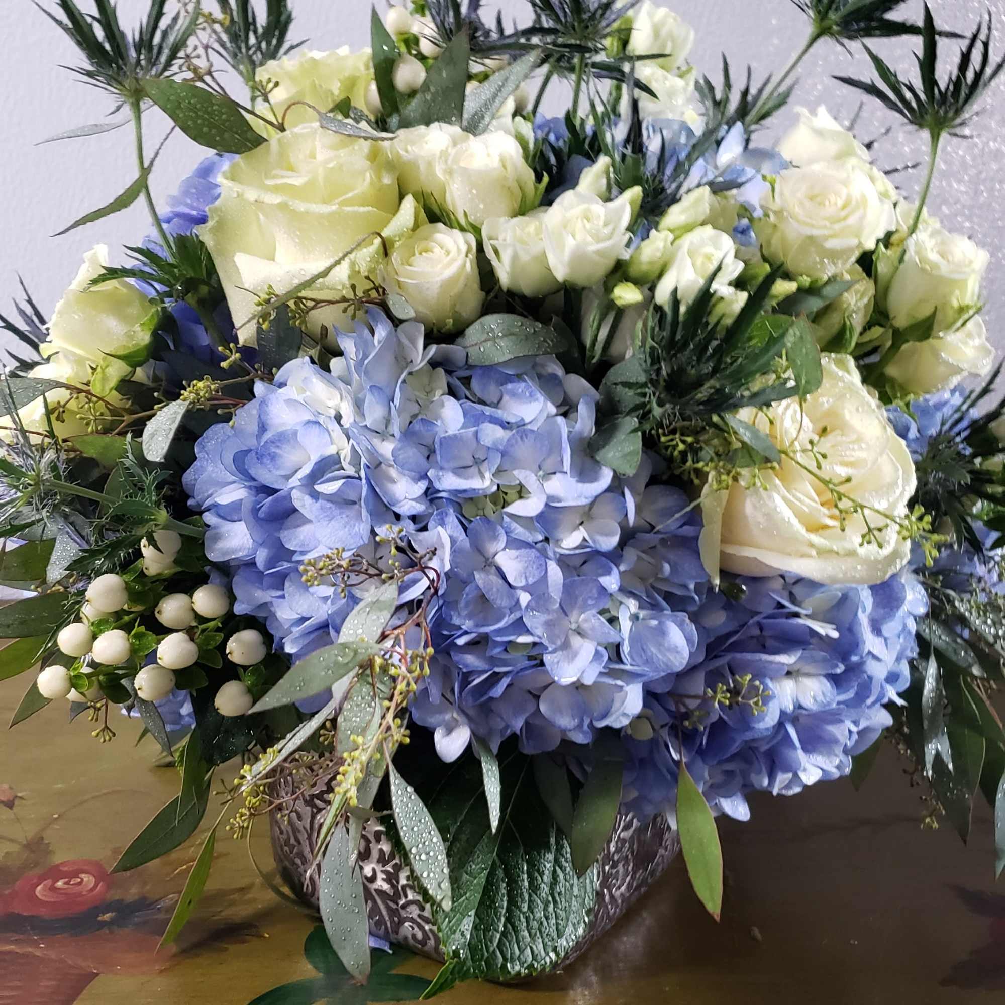  Elegant copper cube, filled with perry winkle blue hydrangea blooms,white roses