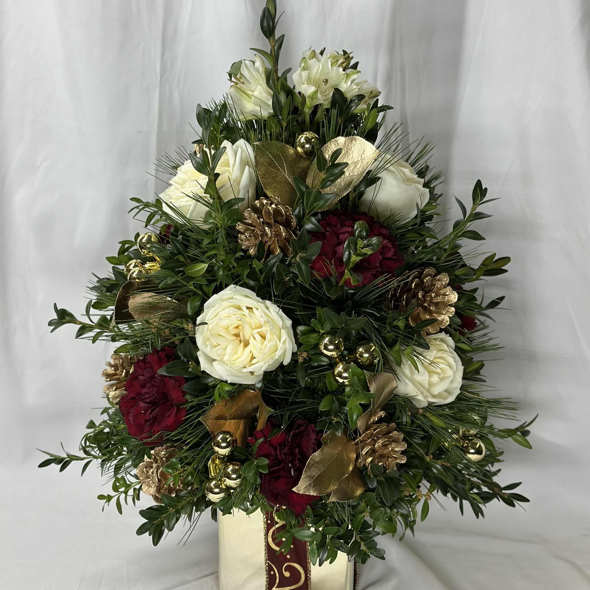 This is a beautiful rendition of a Christmas tree using real boxwood