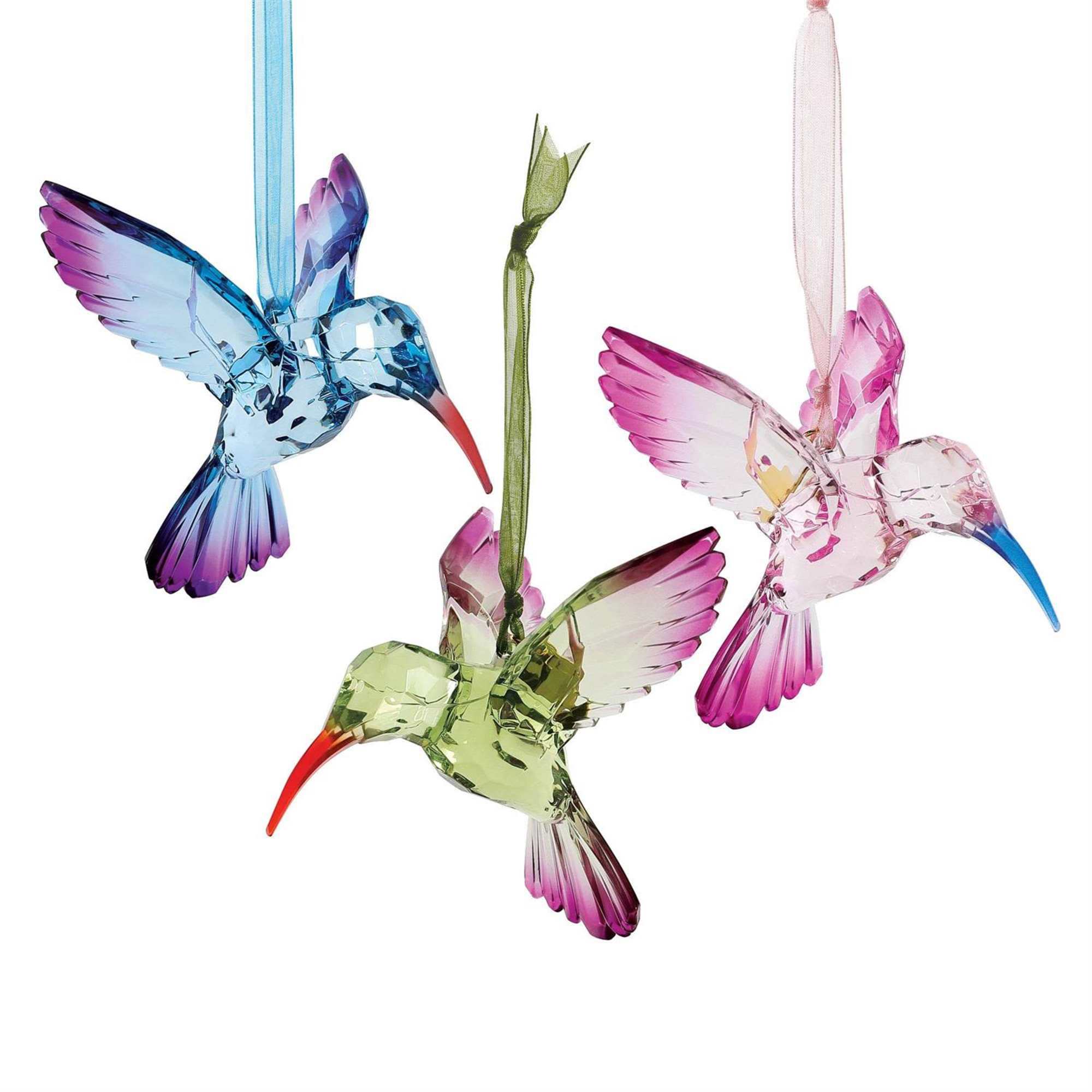 Graceful and radiant, the Enchanted Hummingbird Ornament brings a touch of magic