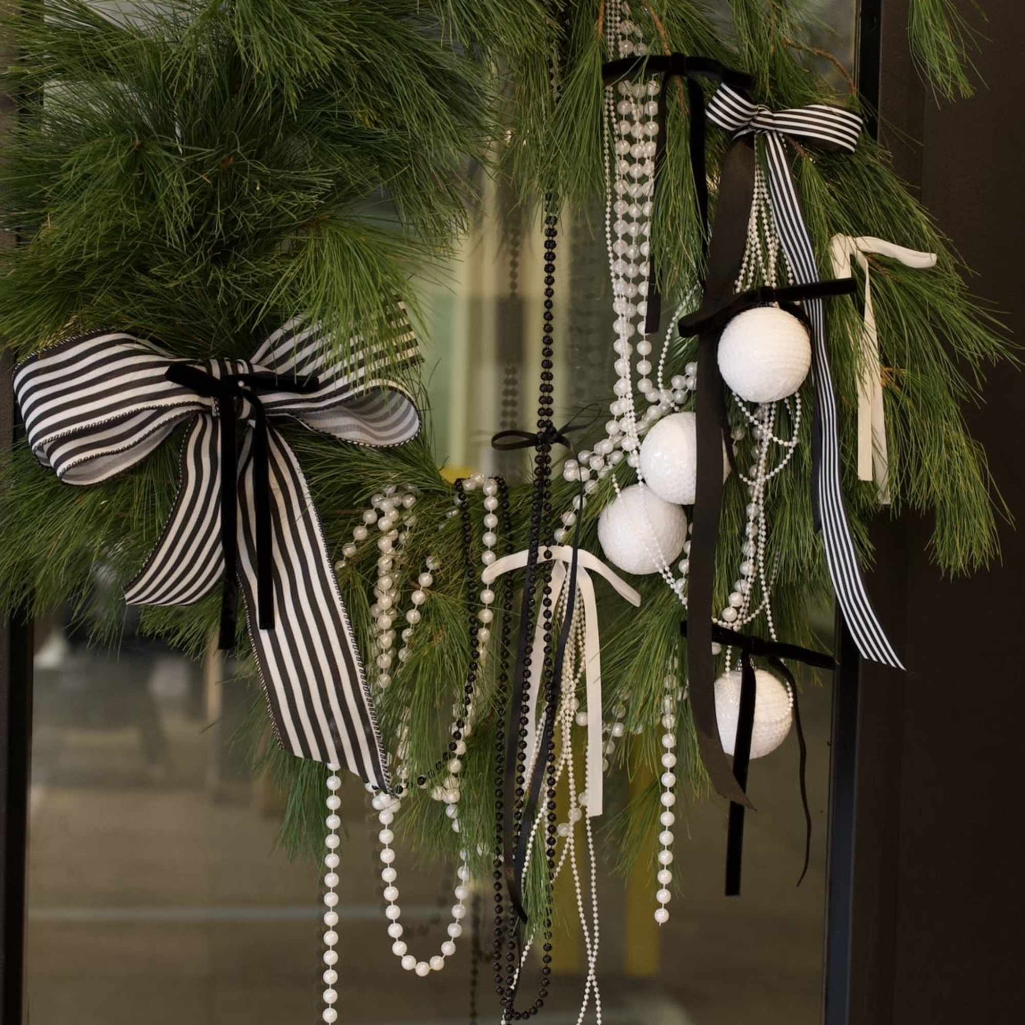 A clean and modern black-and-white wreath that instantly makes any space feel