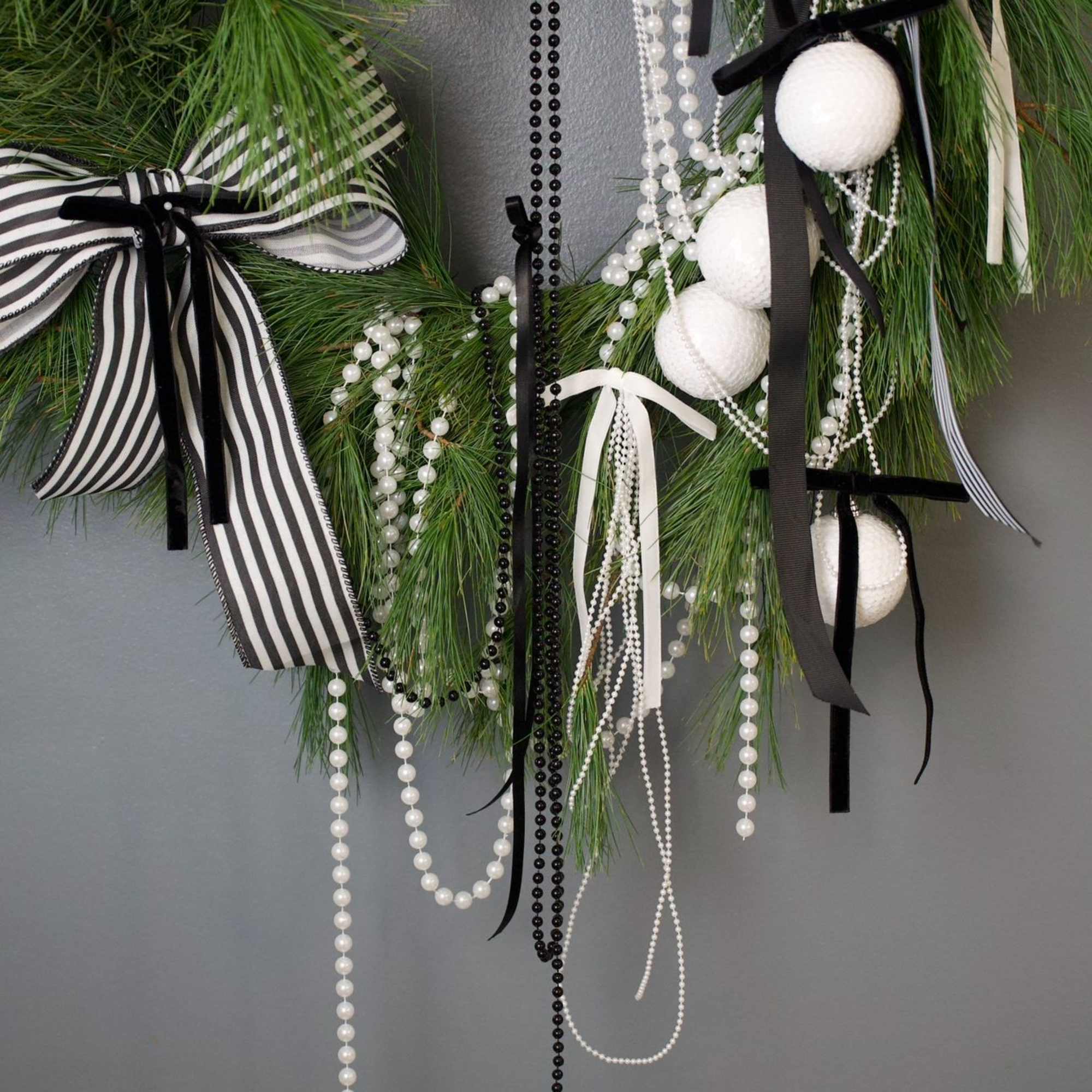 A clean and modern black-and-white wreath that instantly makes any space feel