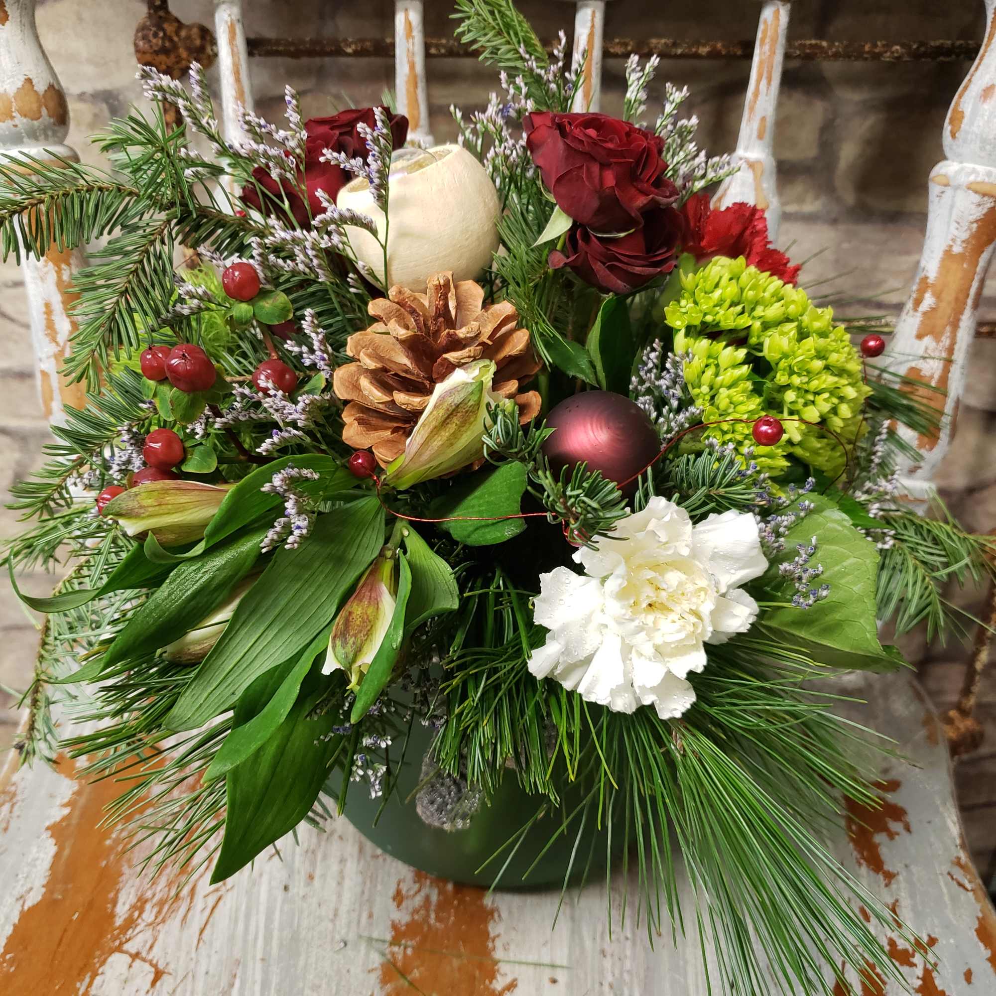 Seasonal evergreens with a variety of blooms with nature.
The gray/silver tone enhances