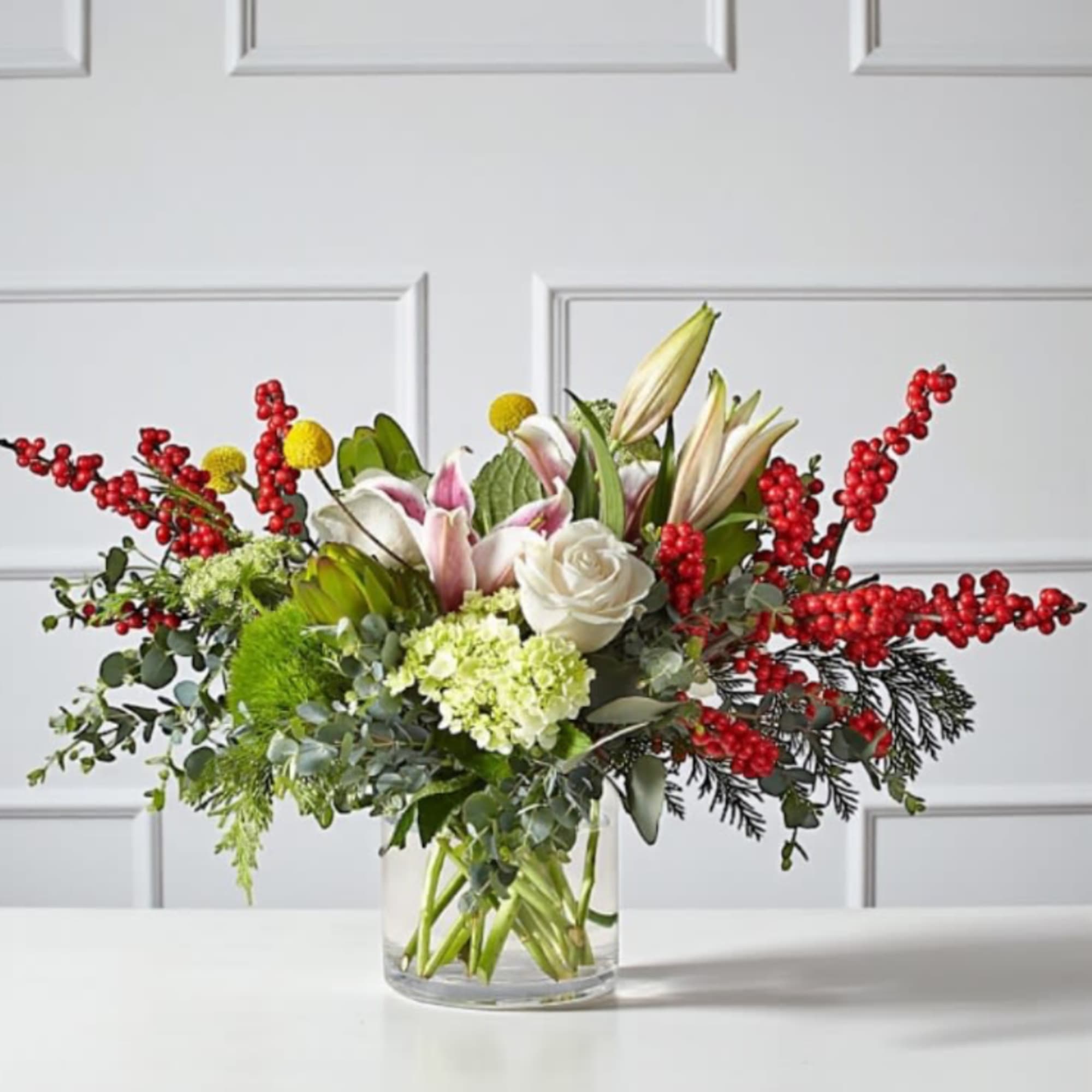 Celebrate the season with our Berry Bright Bouquet, a cheerful blend of