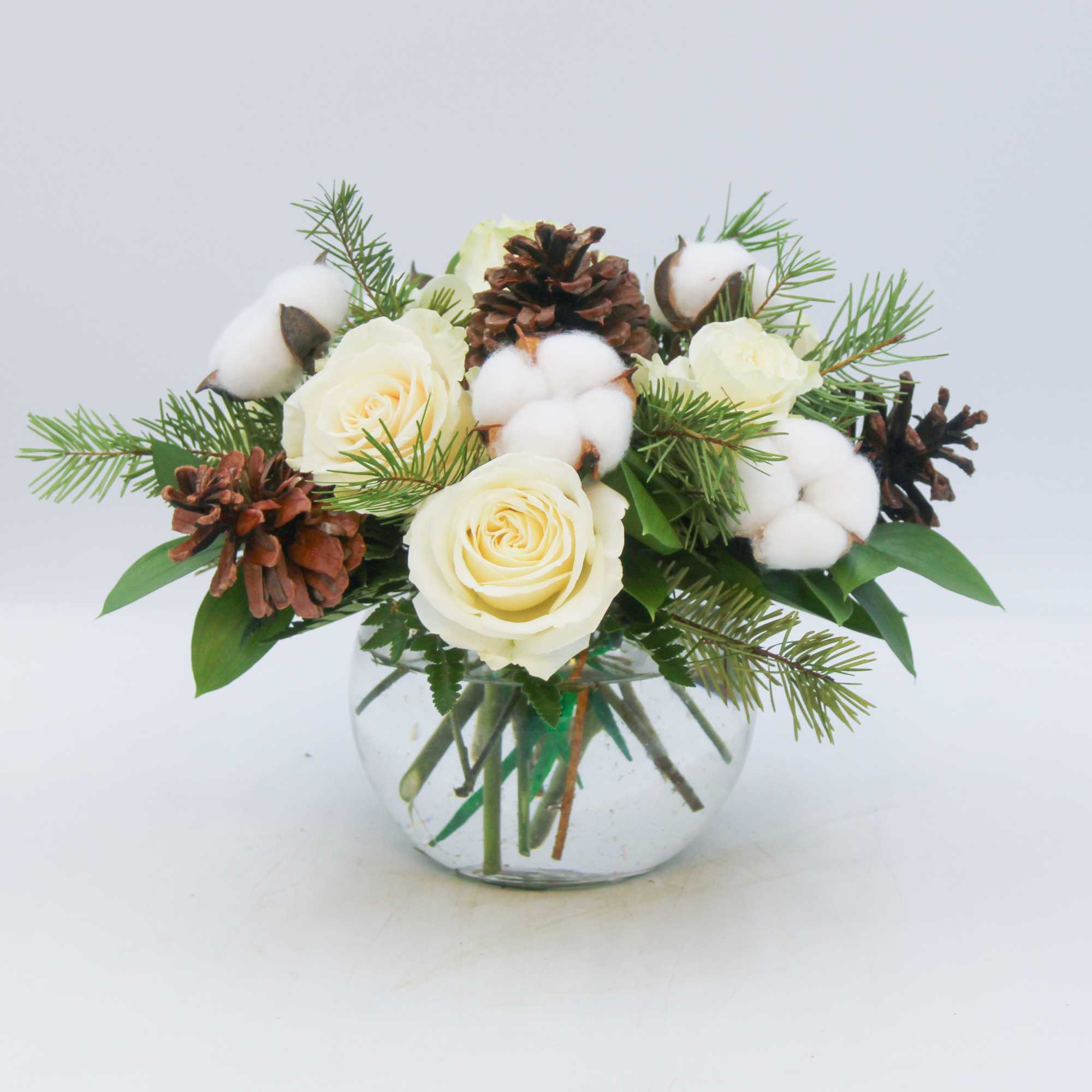 Aspen is a wintery mix of White Roses, Pinecones and Snow puffs
