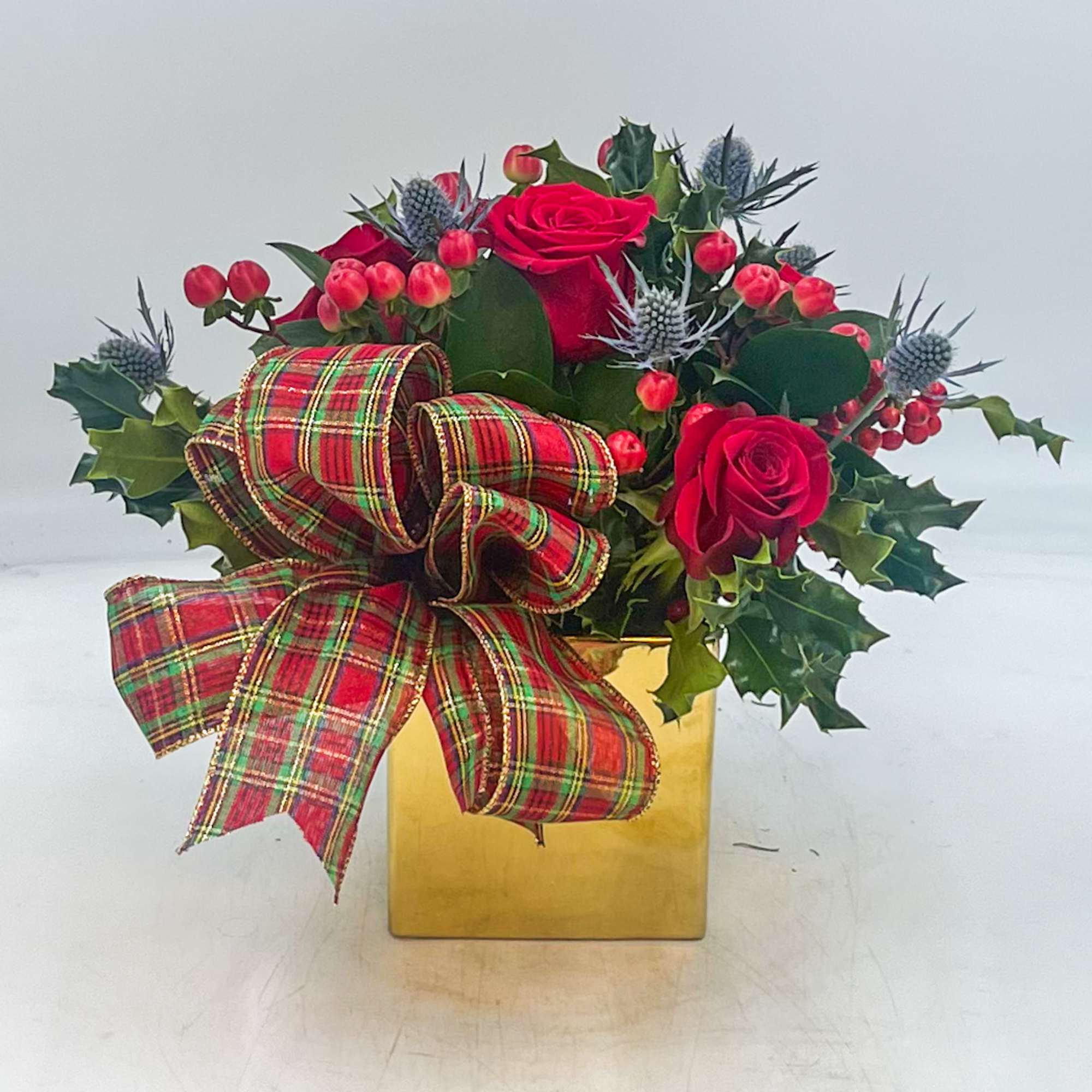A fun Christmas arrangement, Little Saint Nick Lane features a Tartan Bow
