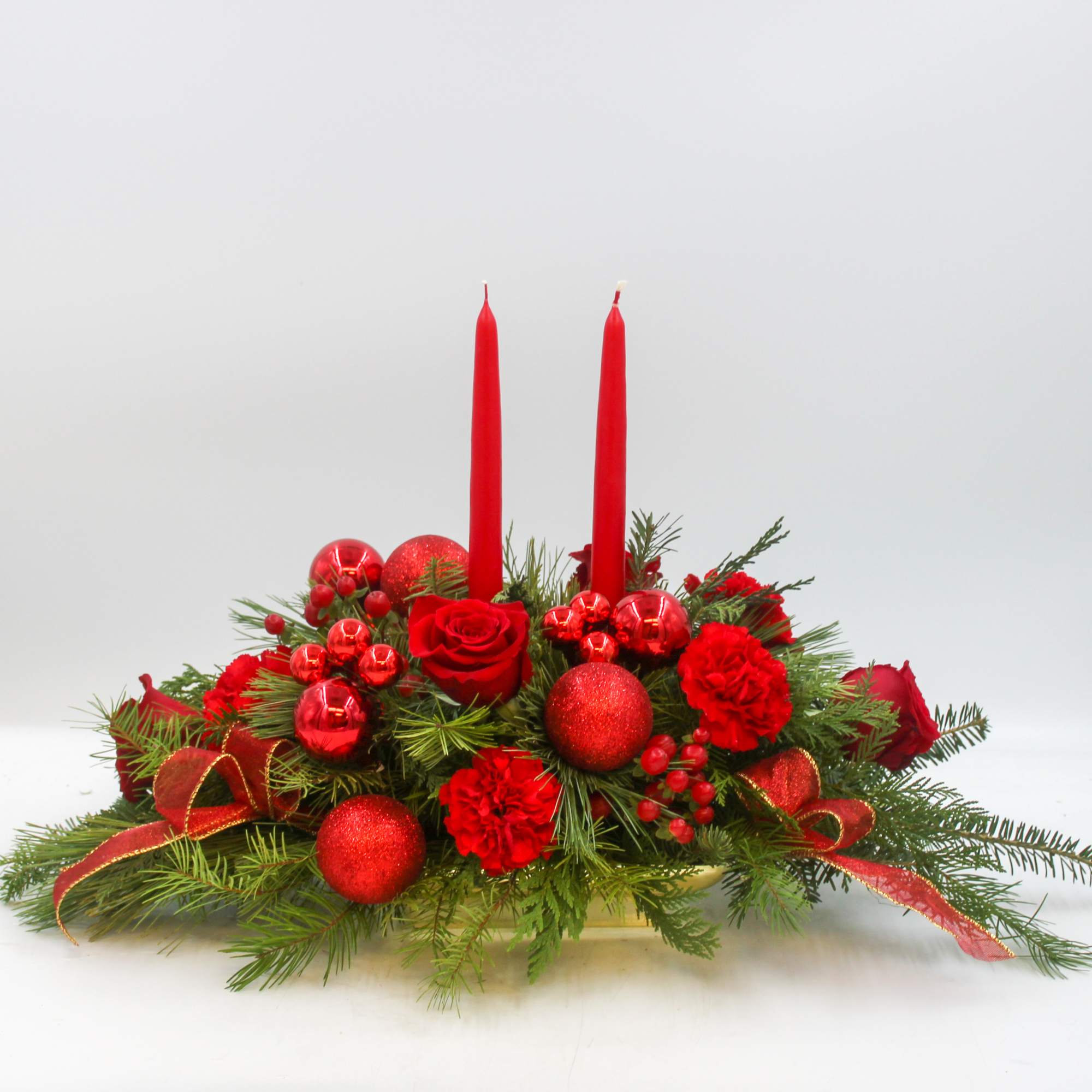 Rudolph lights the way with this all red traditional Christmas Centerpiece with