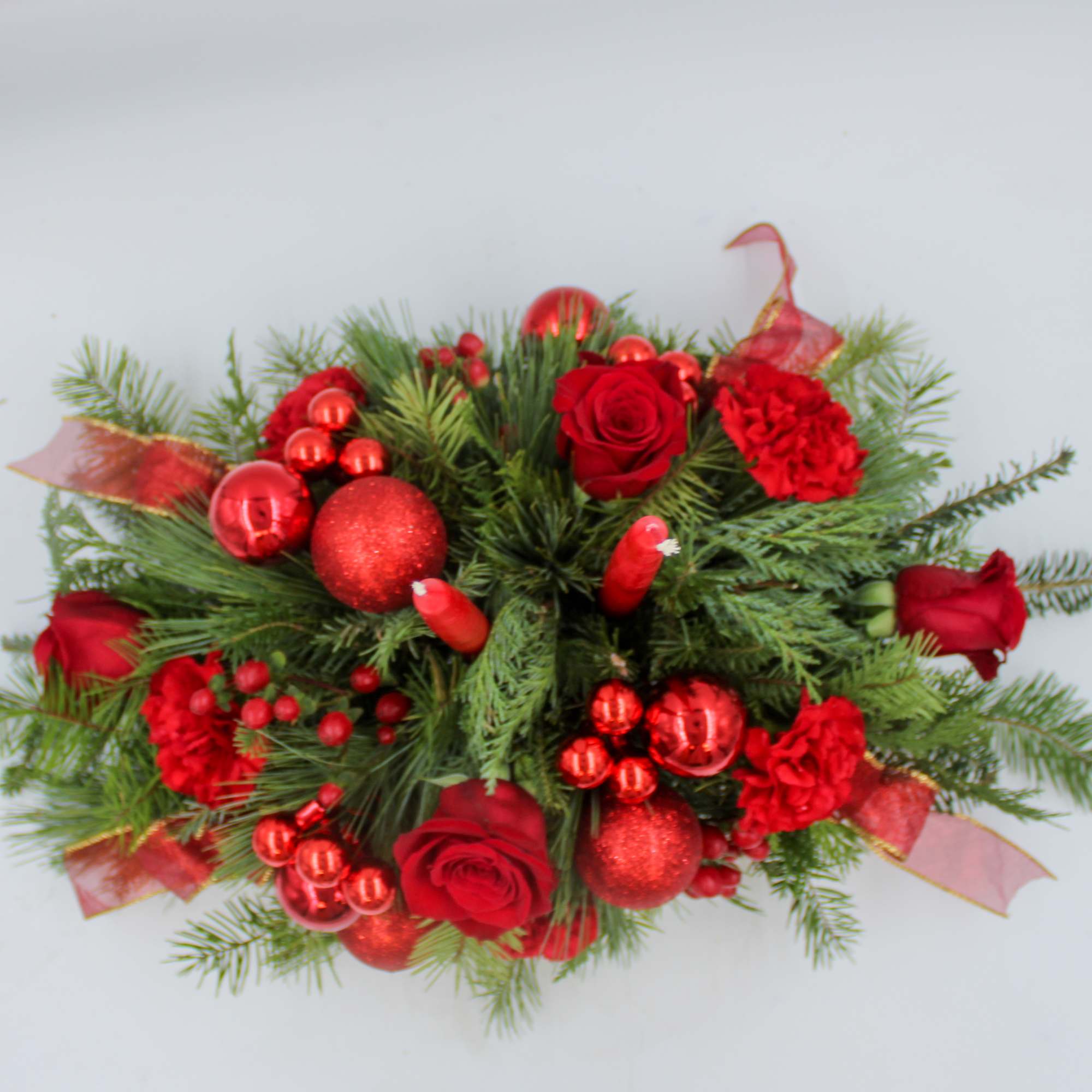 Rudolph lights the way with this all red traditional Christmas Centerpiece with