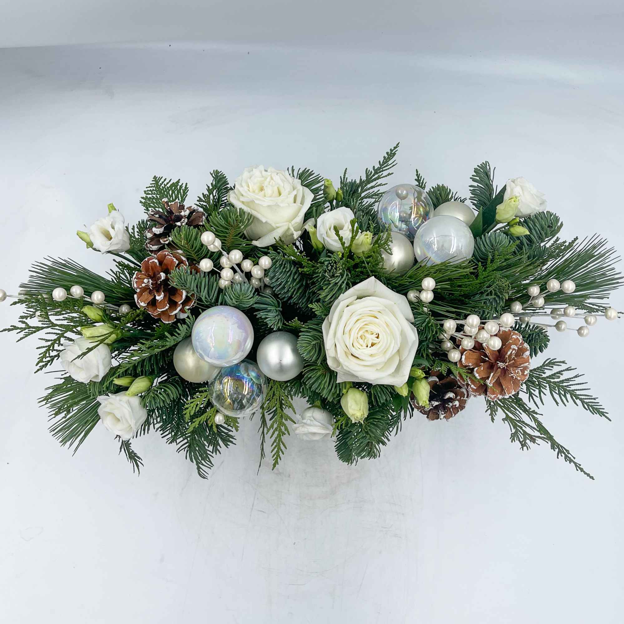 A beautiful gold and white Christmas Centerpiece, Christmas Dreaming features Snowcapped Pinecones