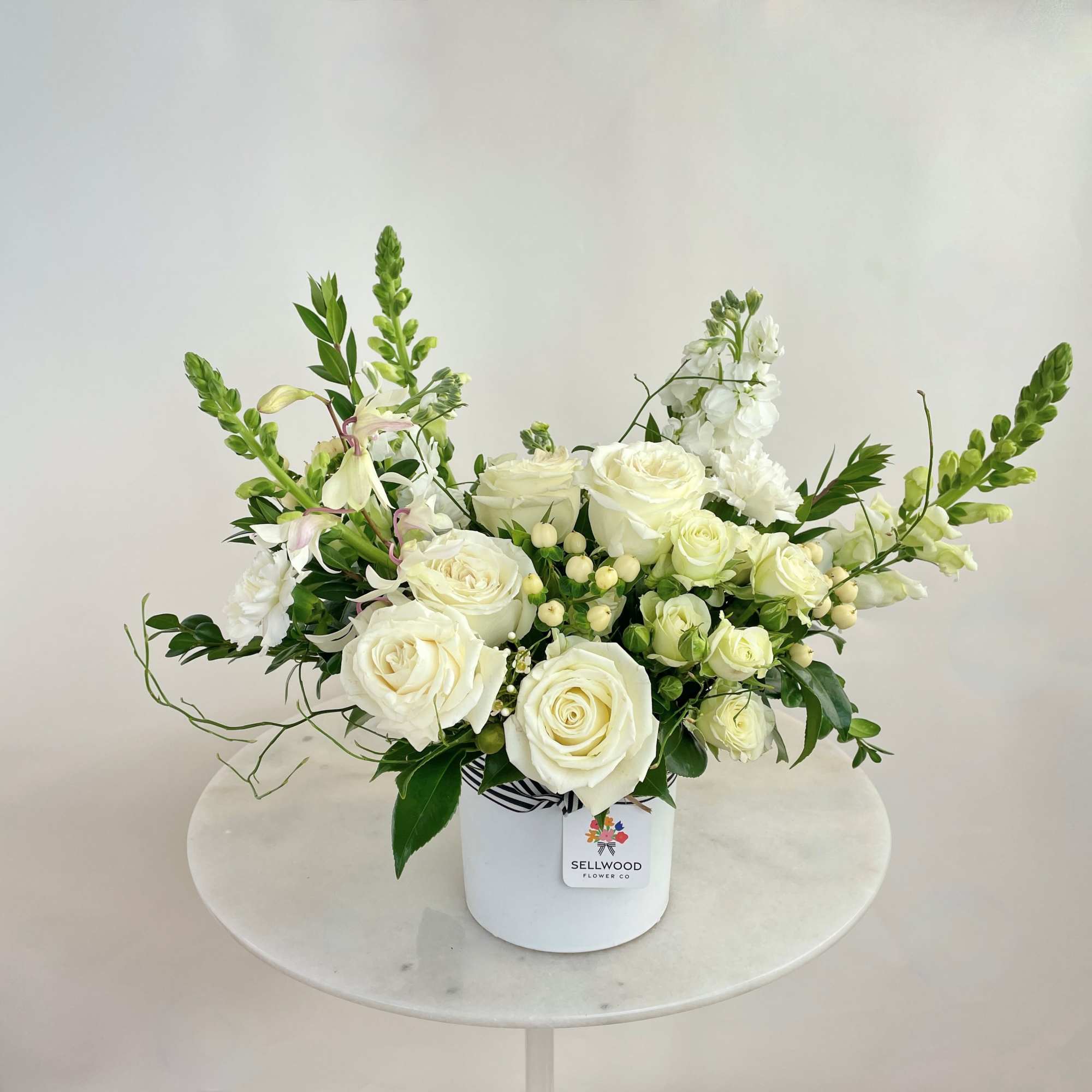 A stunning white bouquet that evokes simplicity, calmness, and peace. This arrangement