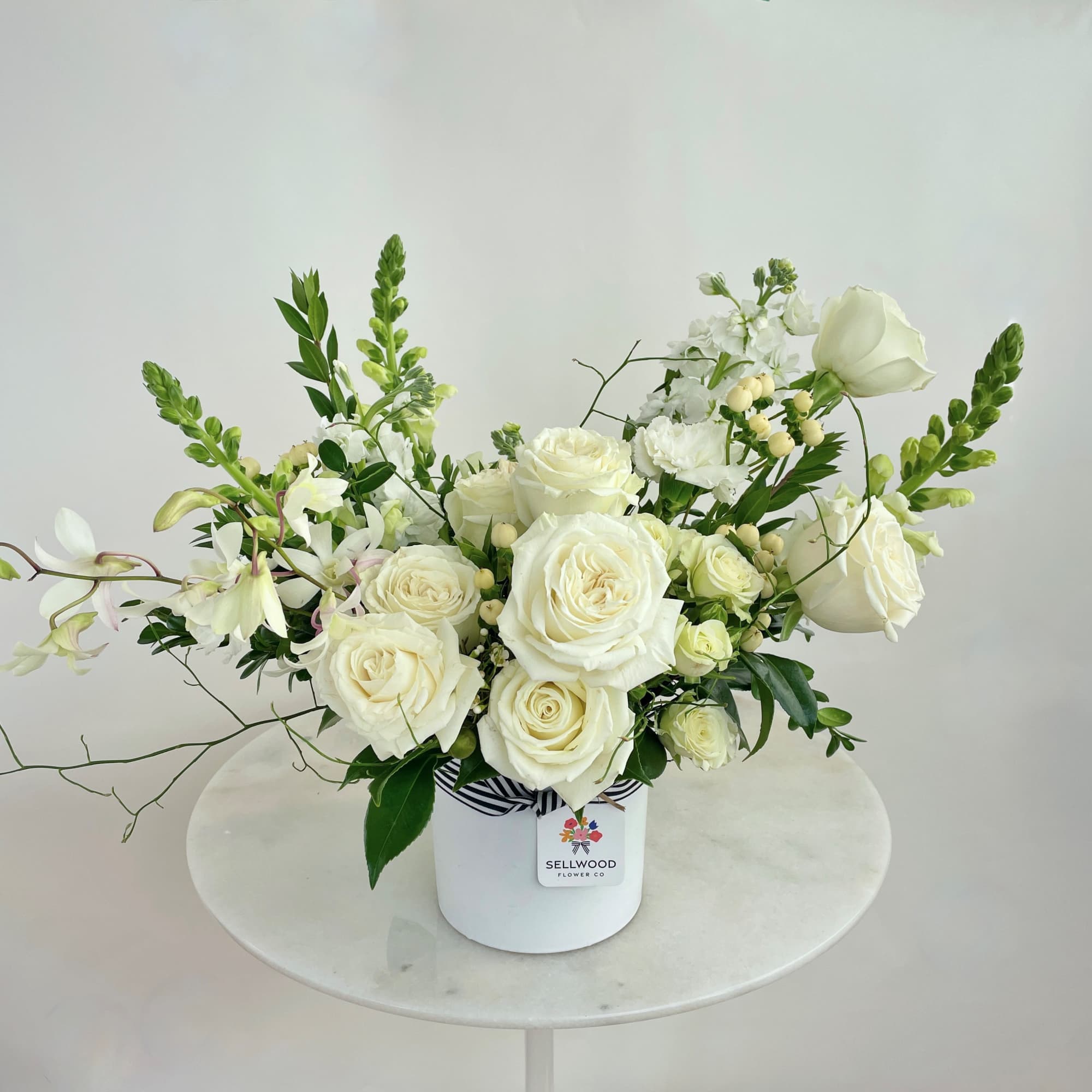 A stunning white bouquet that evokes simplicity, calmness, and peace. This arrangement