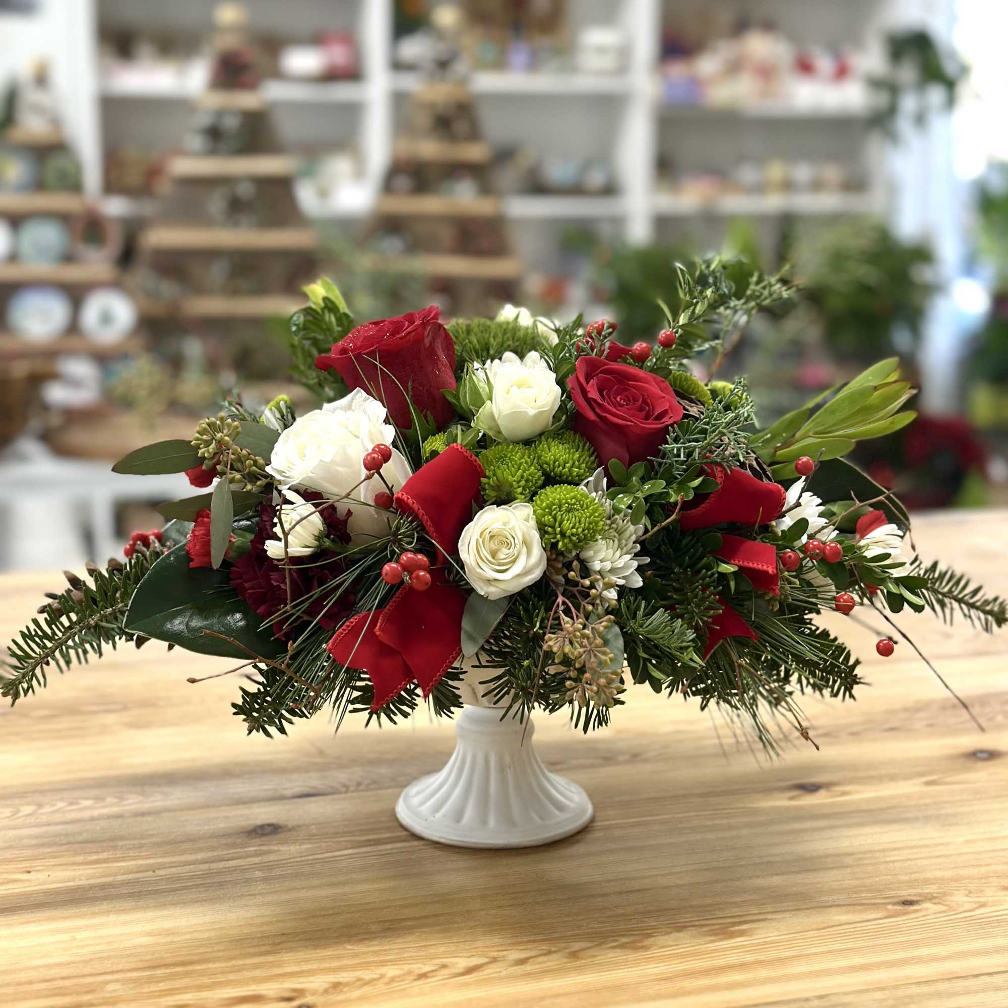 Elevate your holiday gatherings with the Holiday Harmony Centerpiece by Westford Florist.