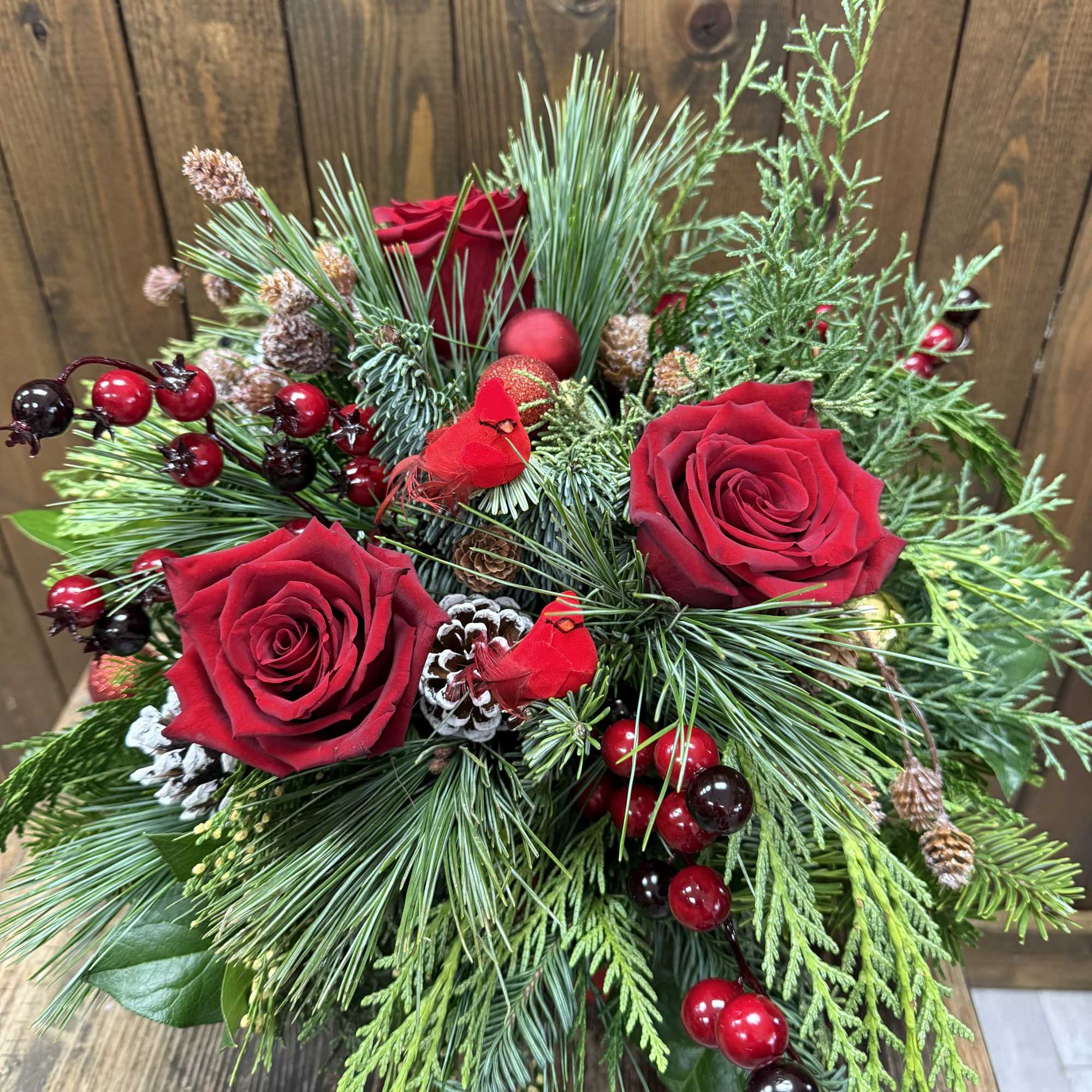 Embrace the enchantment of the holiday season with a breathtaking arrangement featuring