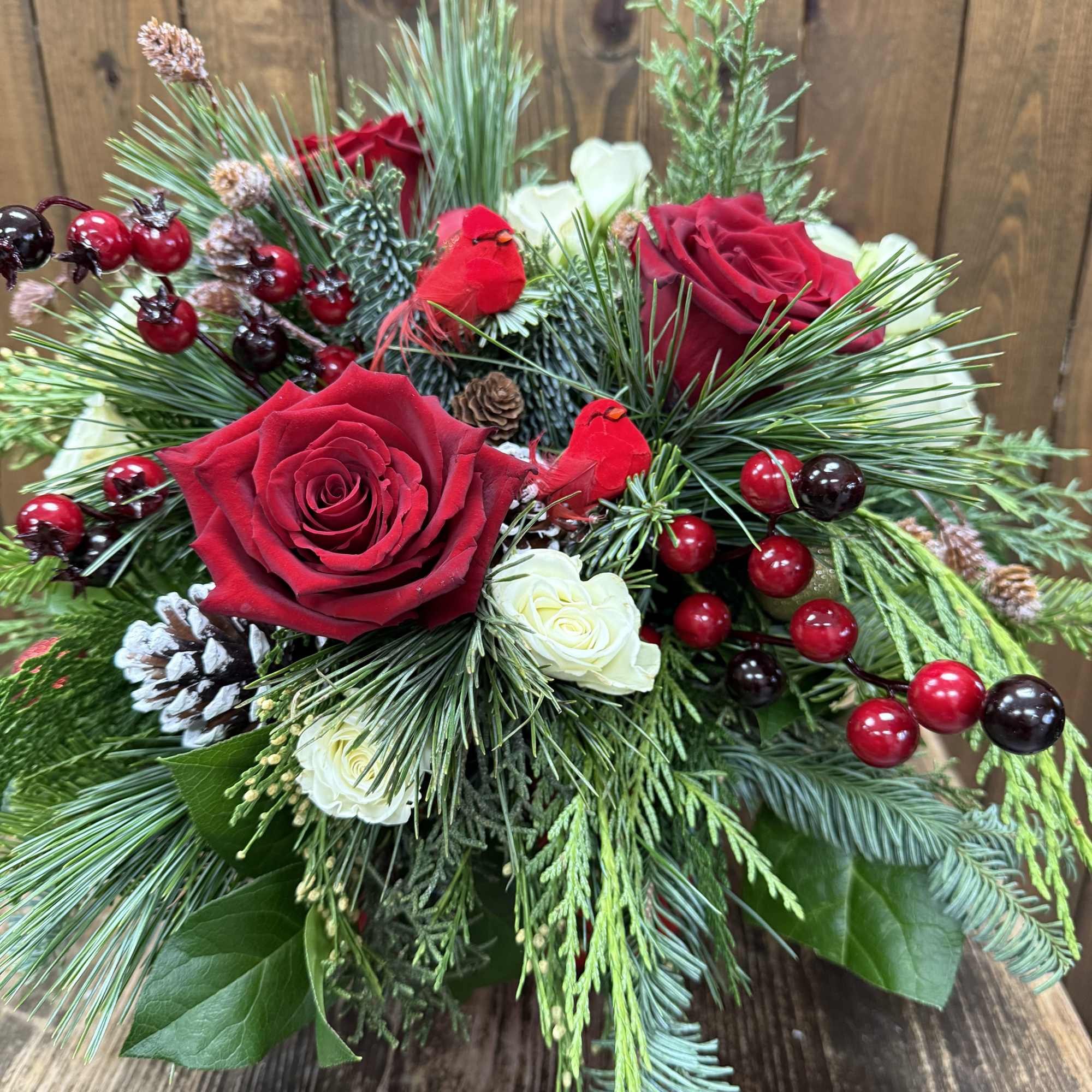 Embrace the enchantment of the holiday season with a breathtaking arrangement featuring