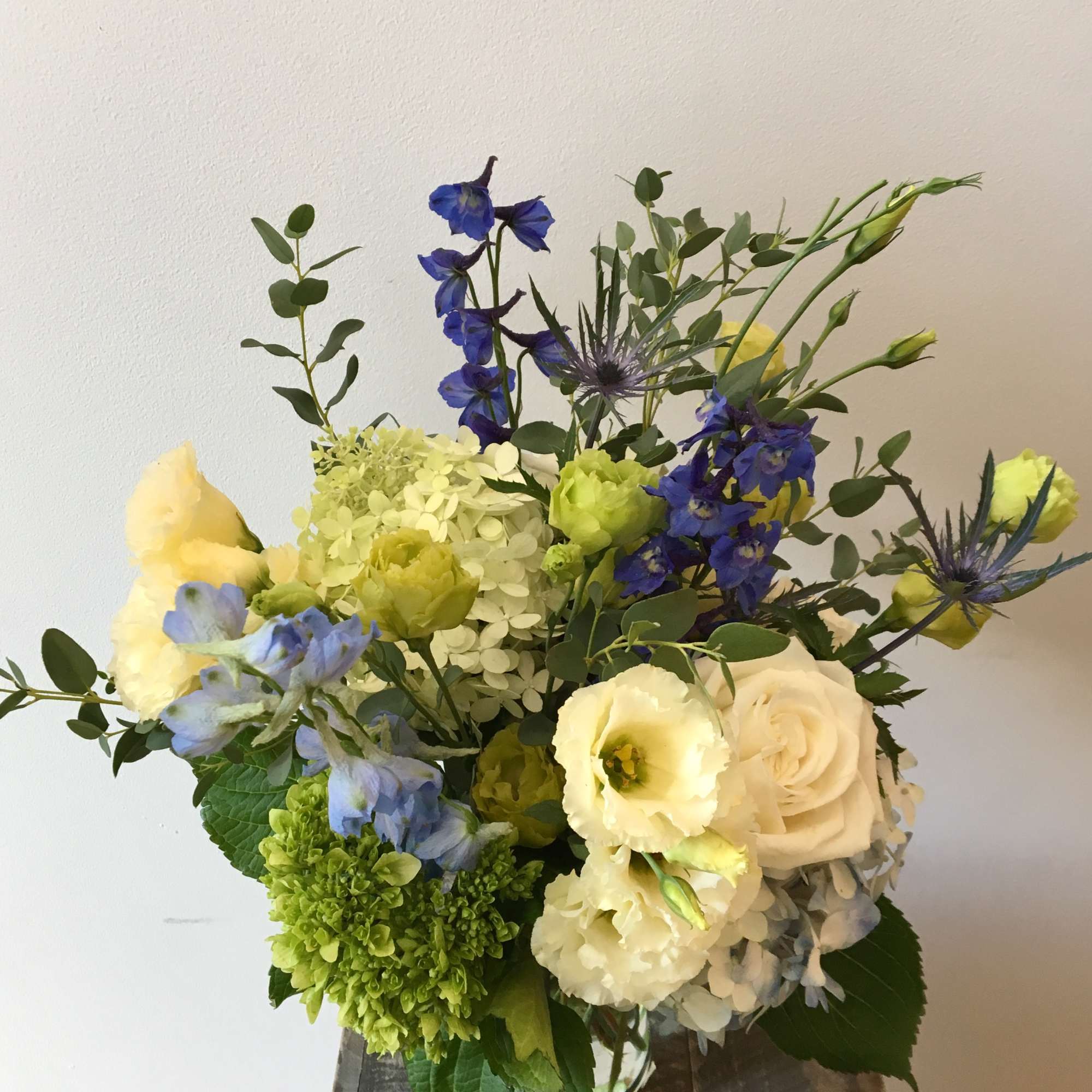 A sweet design in various shades of blues, whites and greens, featuring