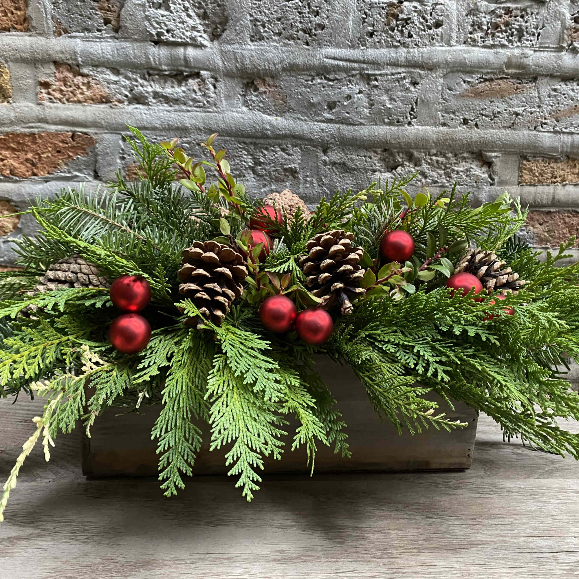 Variety of Evergreens, pinecones and holiday accents - NO FLOWERS 
