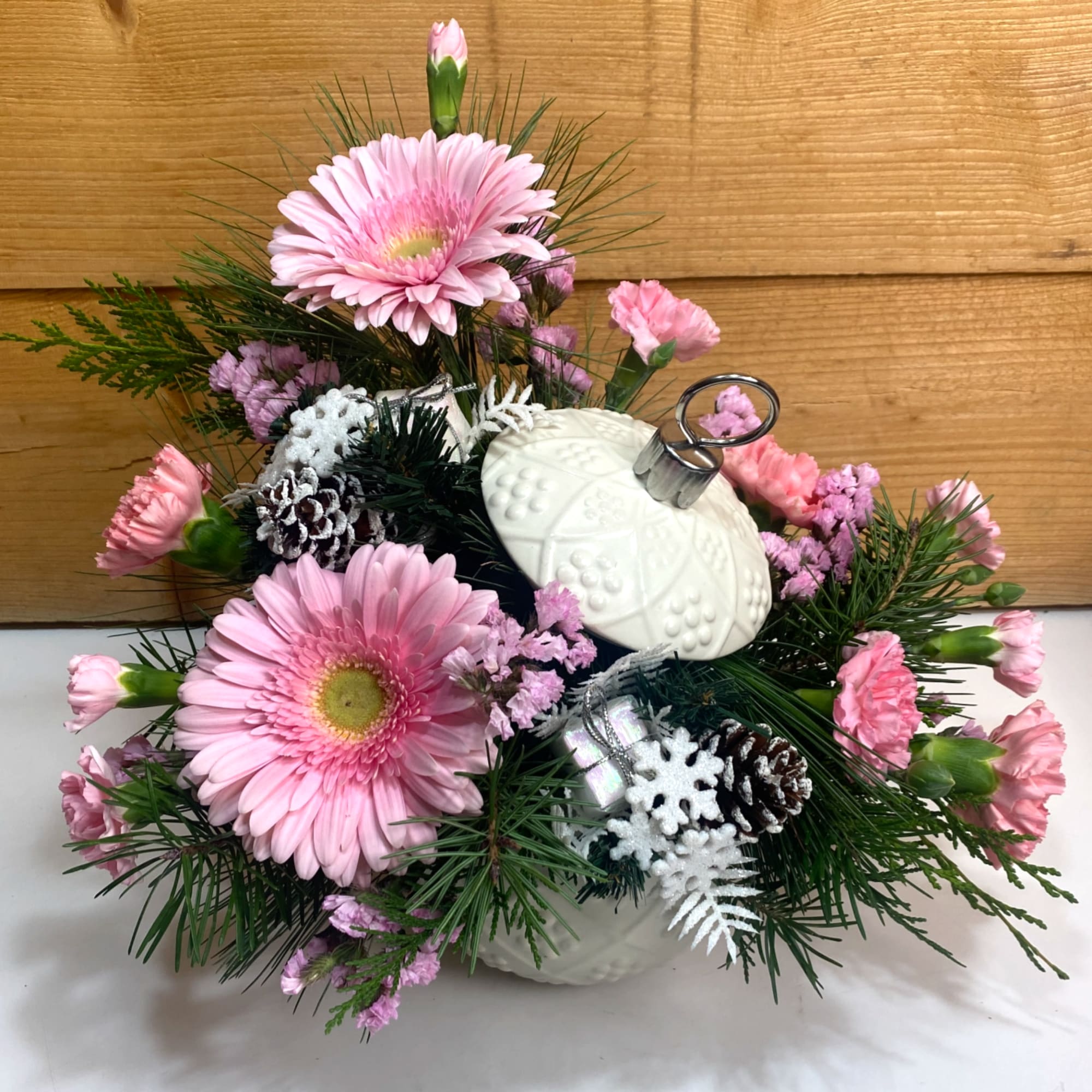 Our Enchanted Ornament arrangement is sure to delight this holiday season! Displayed