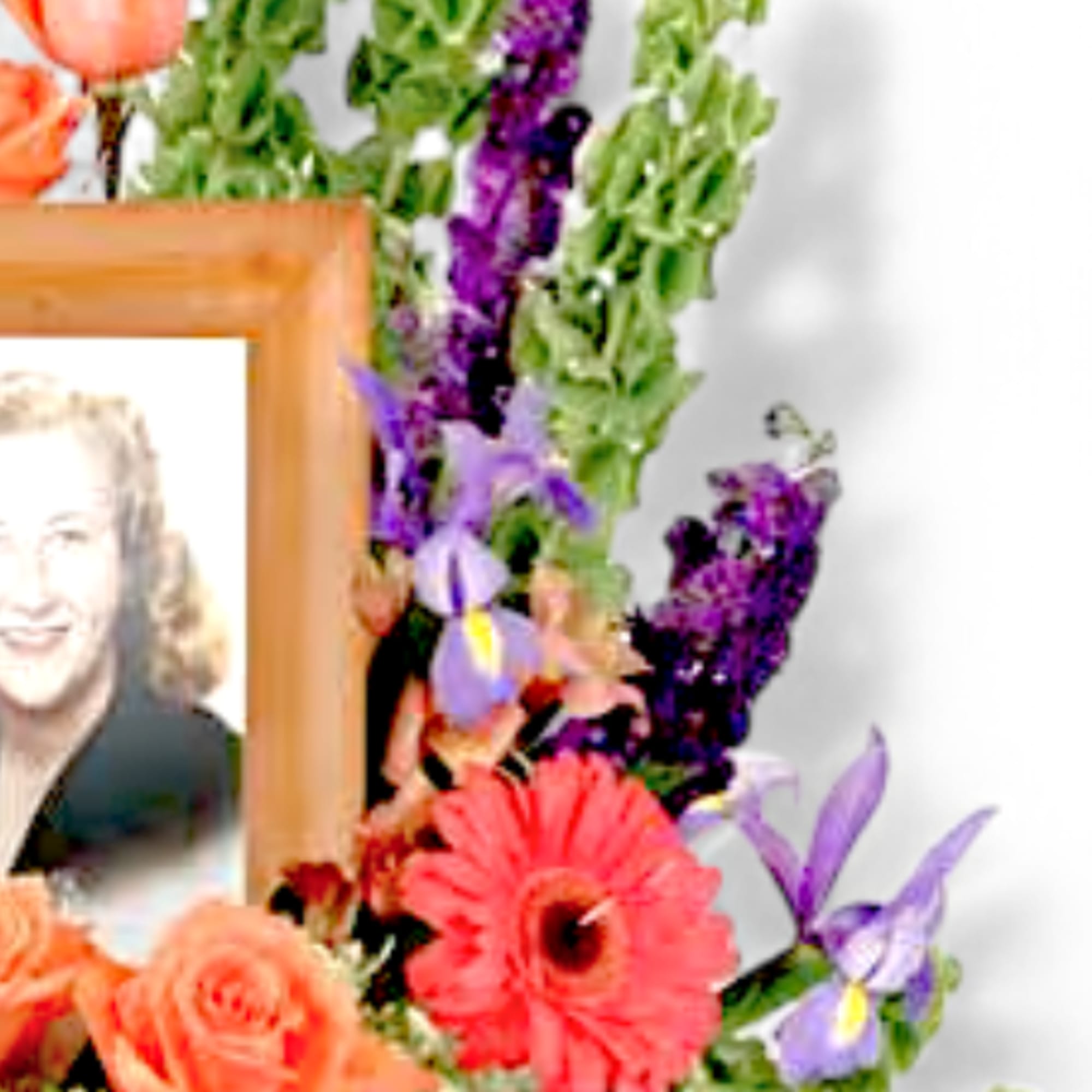Honor a loved one&rsquo;s memory with this vibrant photo tribute arrangement, featuring