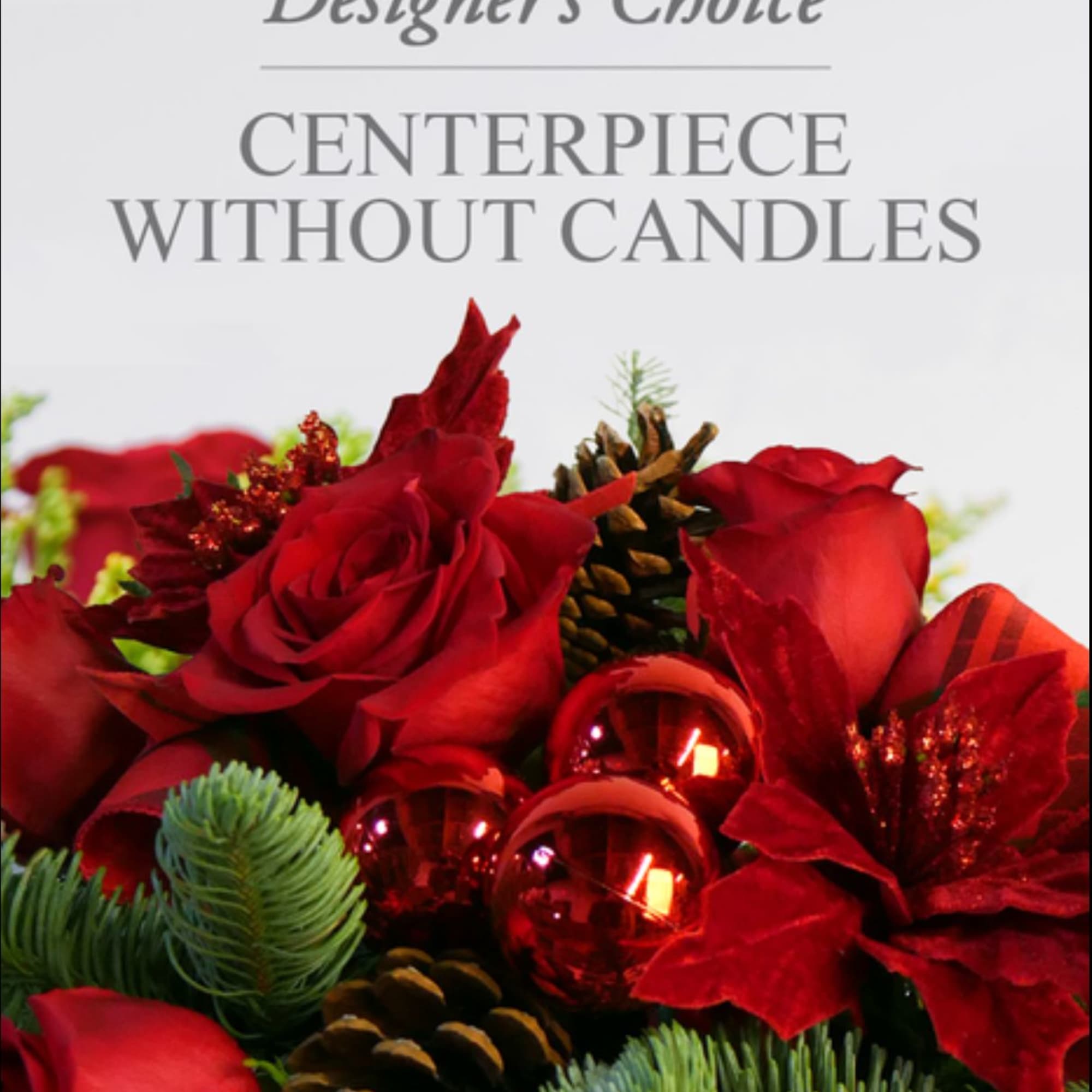 Designers choice of Christmas greens, assorted flowers, and fillers