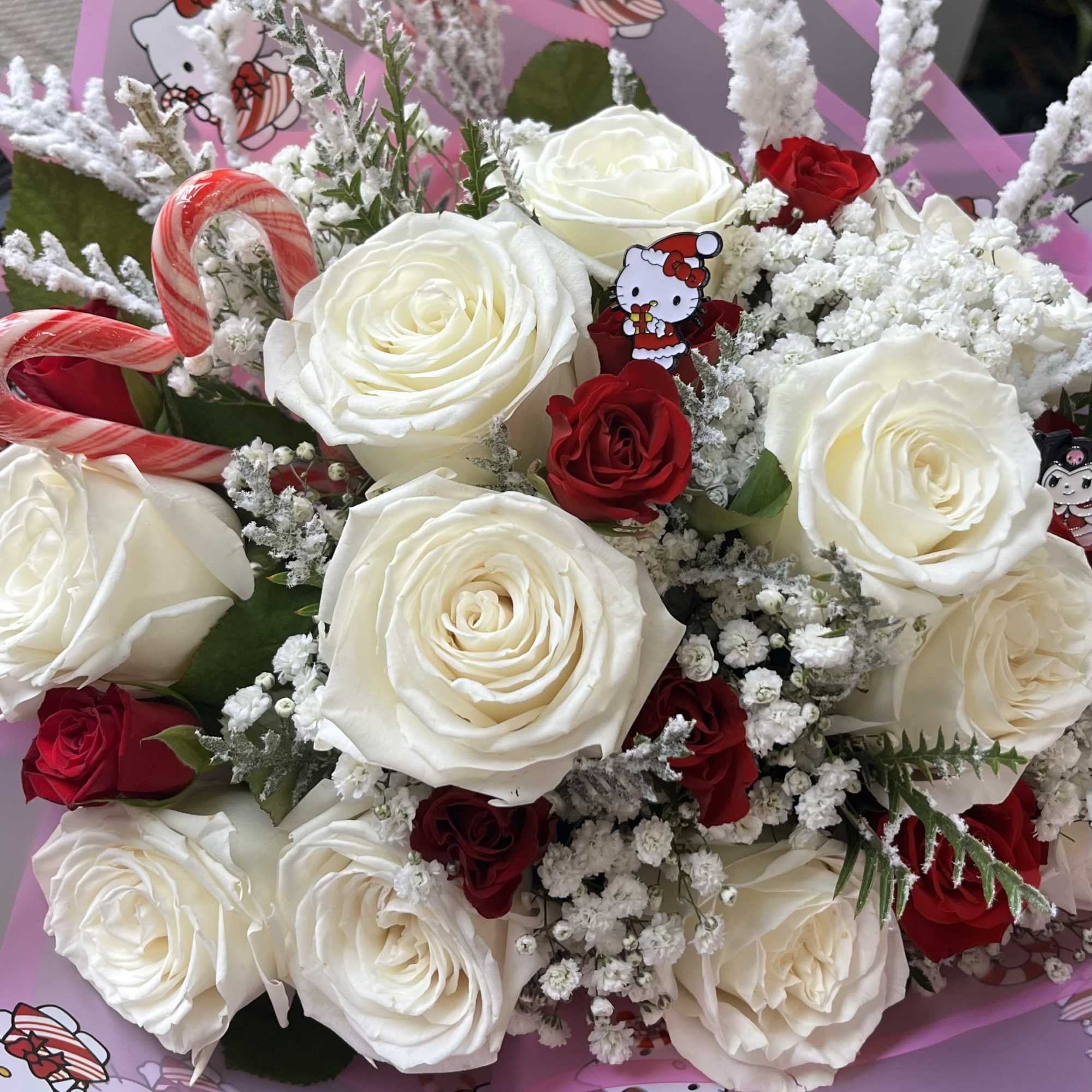 1 dozen roses with baby roses, candy canes, Christmas greenery *** pins