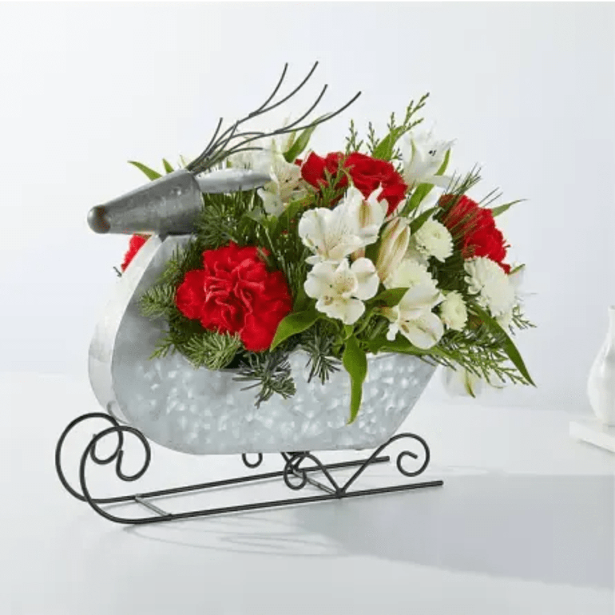 Fly into Christmas Eve with this dashing Prancer Bouquet designed in a
