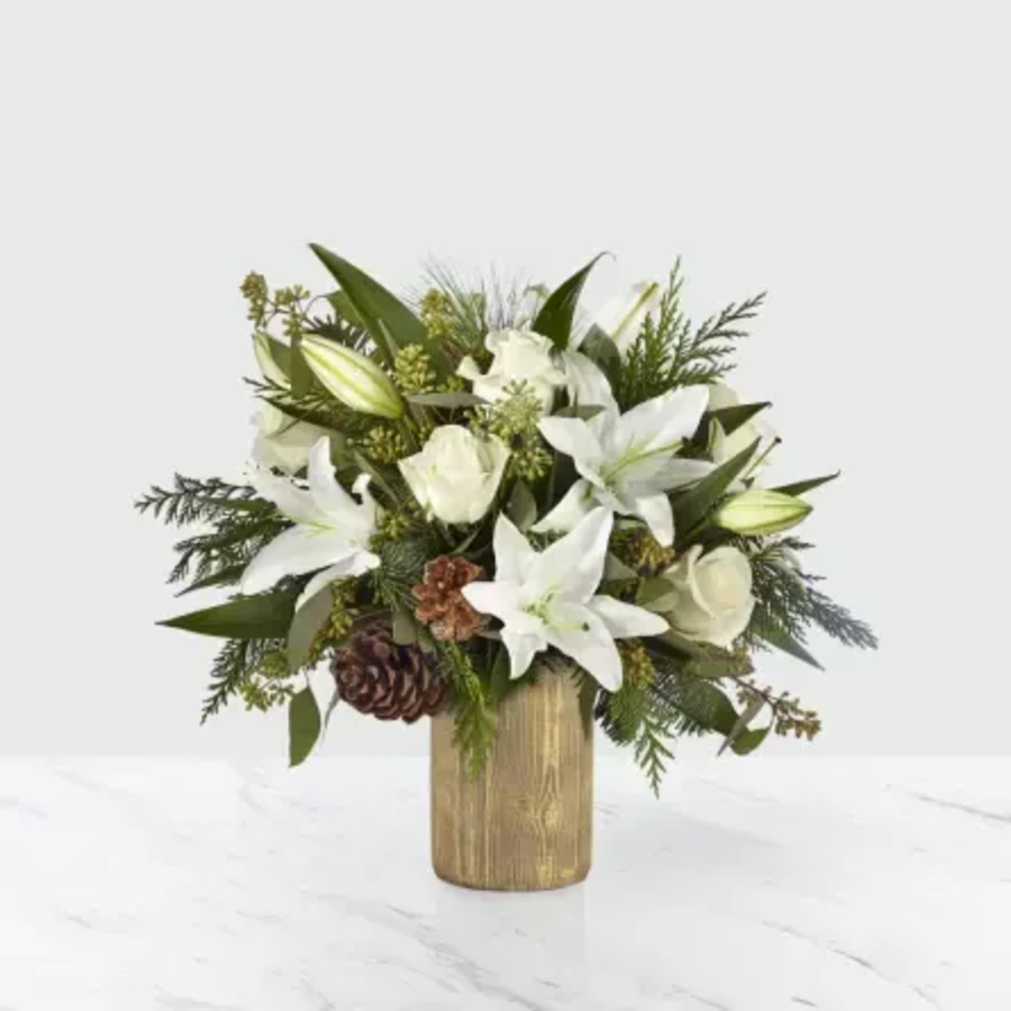 The Joyous Greetings Bouquet is an elegant collection of ivory, cream, and