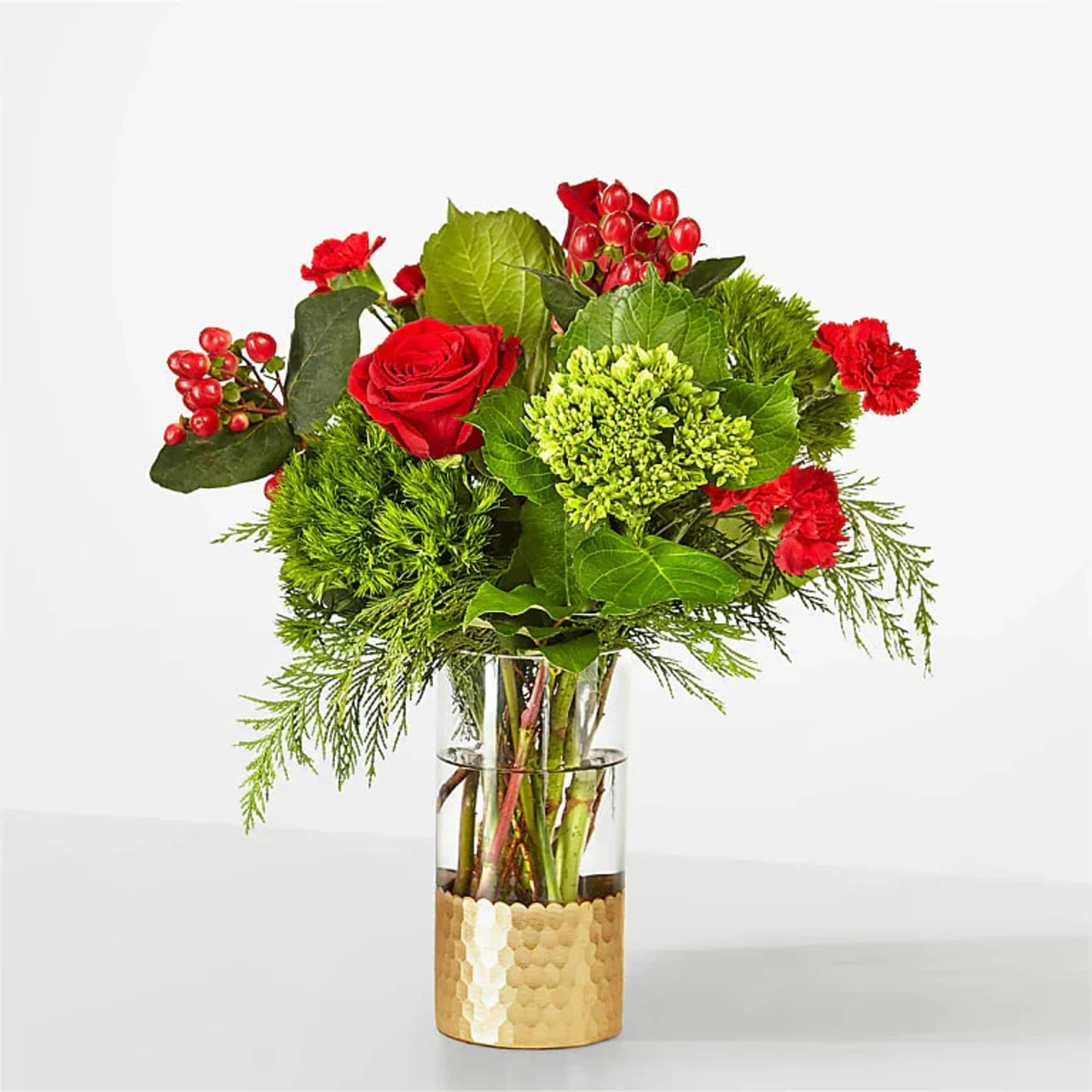 Cozy up with these traditional red and green blooms, a timeless gift