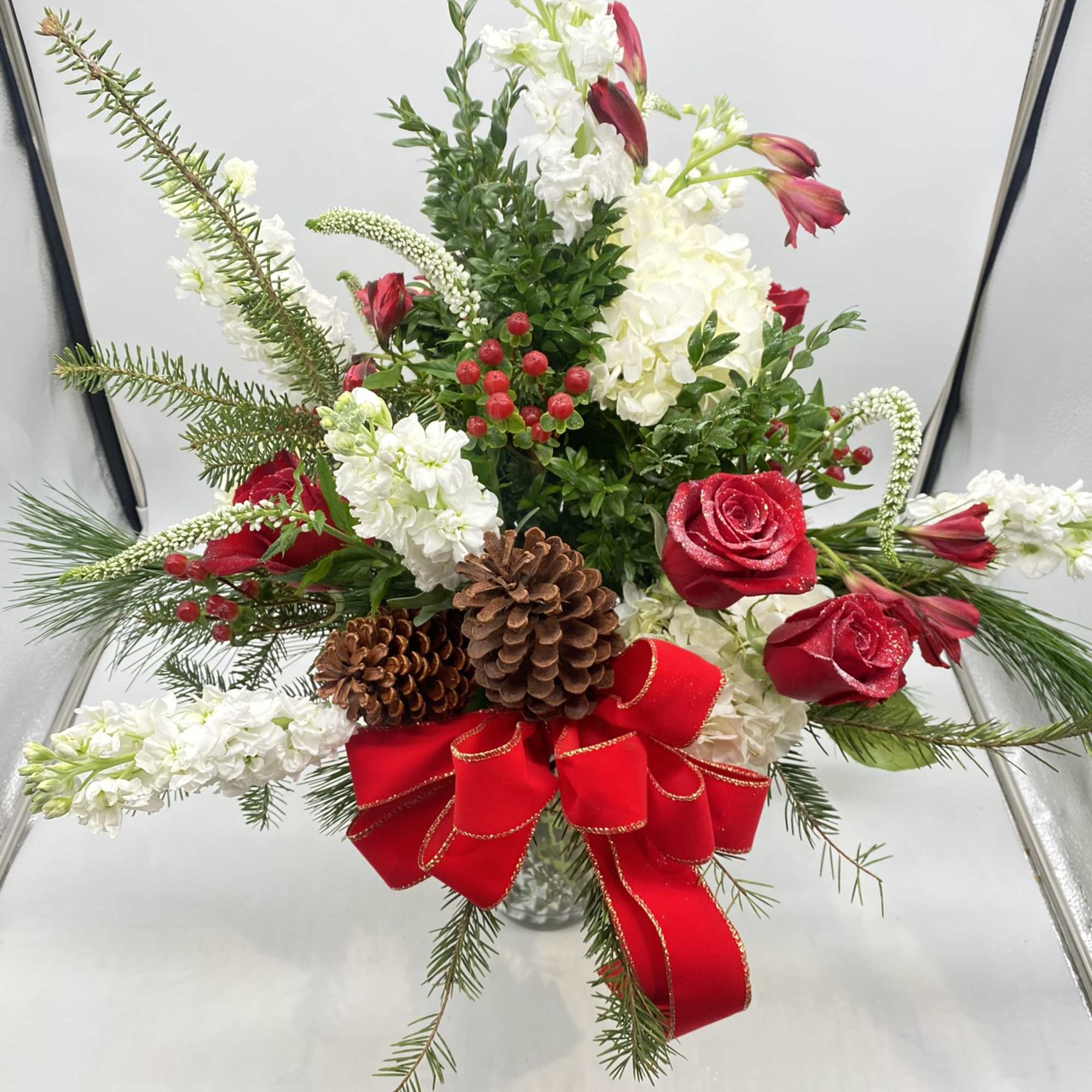 A large Holiday vased arrangement, with fresh 