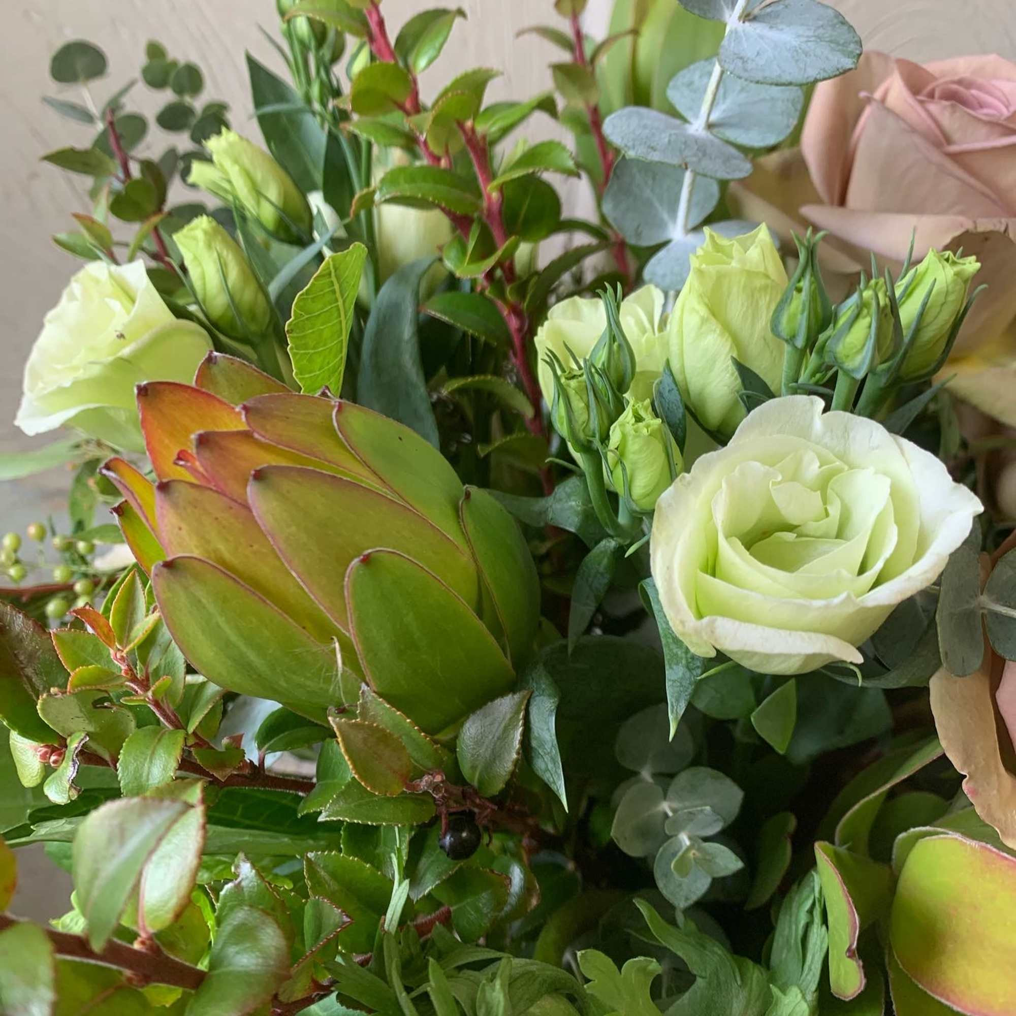 A neutral bouquet of creams and antique tones. Perfect for a housewarming
