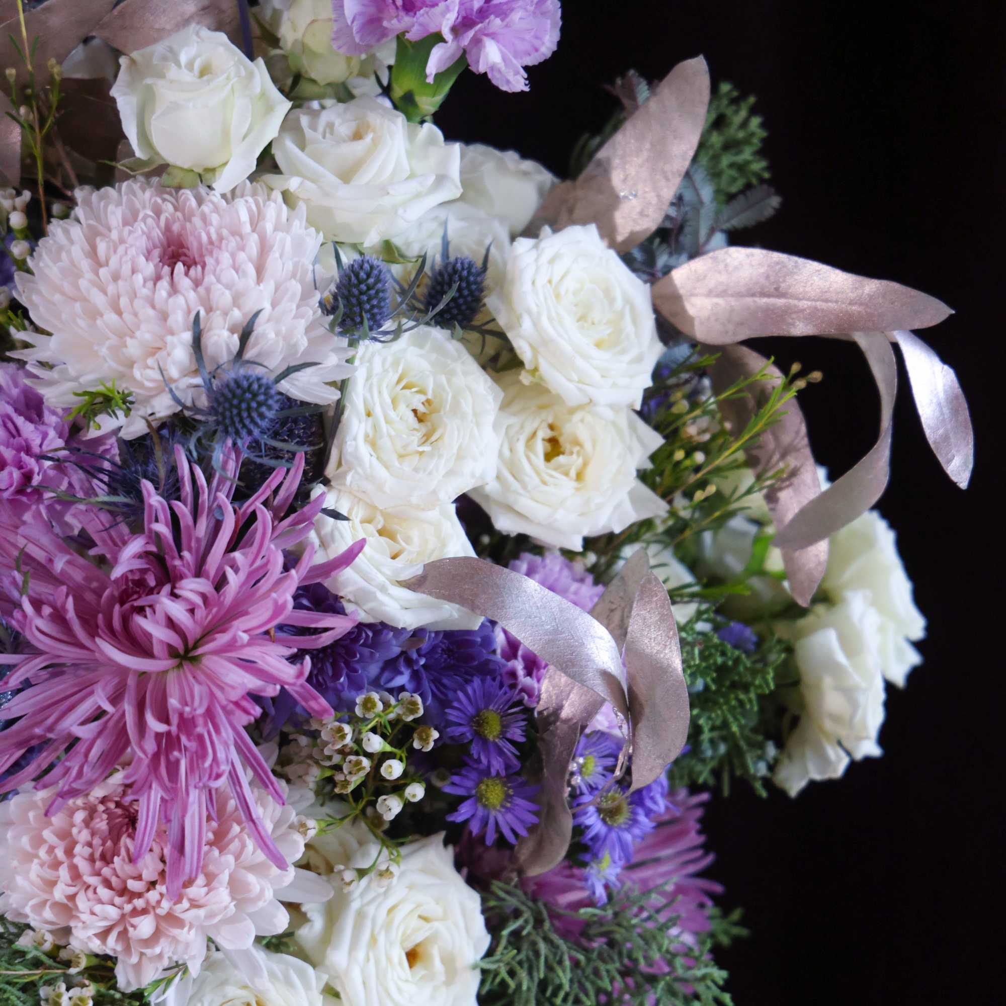 Custom, one of a kind floral arrangements by floral artist Stacy Leafsong.

Arrangement