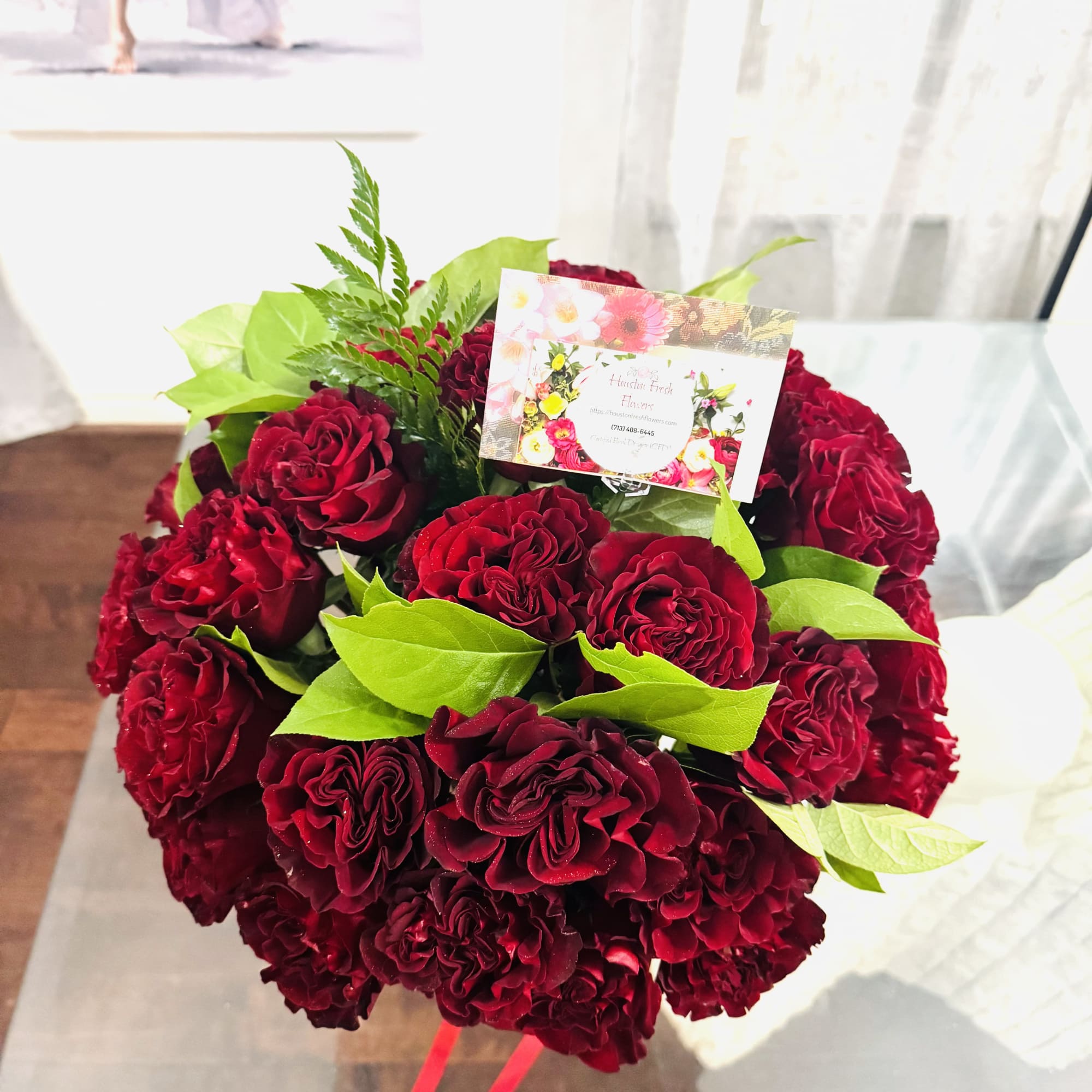 Red Roses in beautiful vase.
A radiant arrangement of red roses graces a