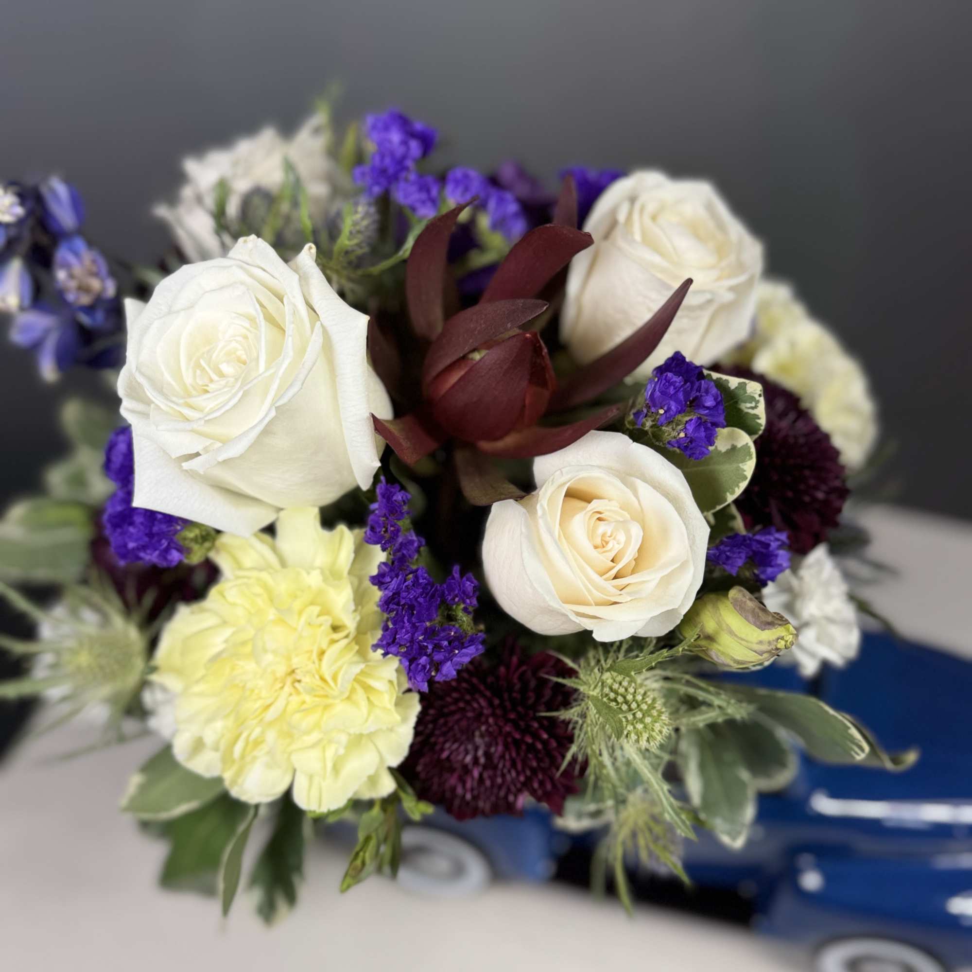  "Vintage Ford Pickup" floral creation, a charming and whimsical ensemble that