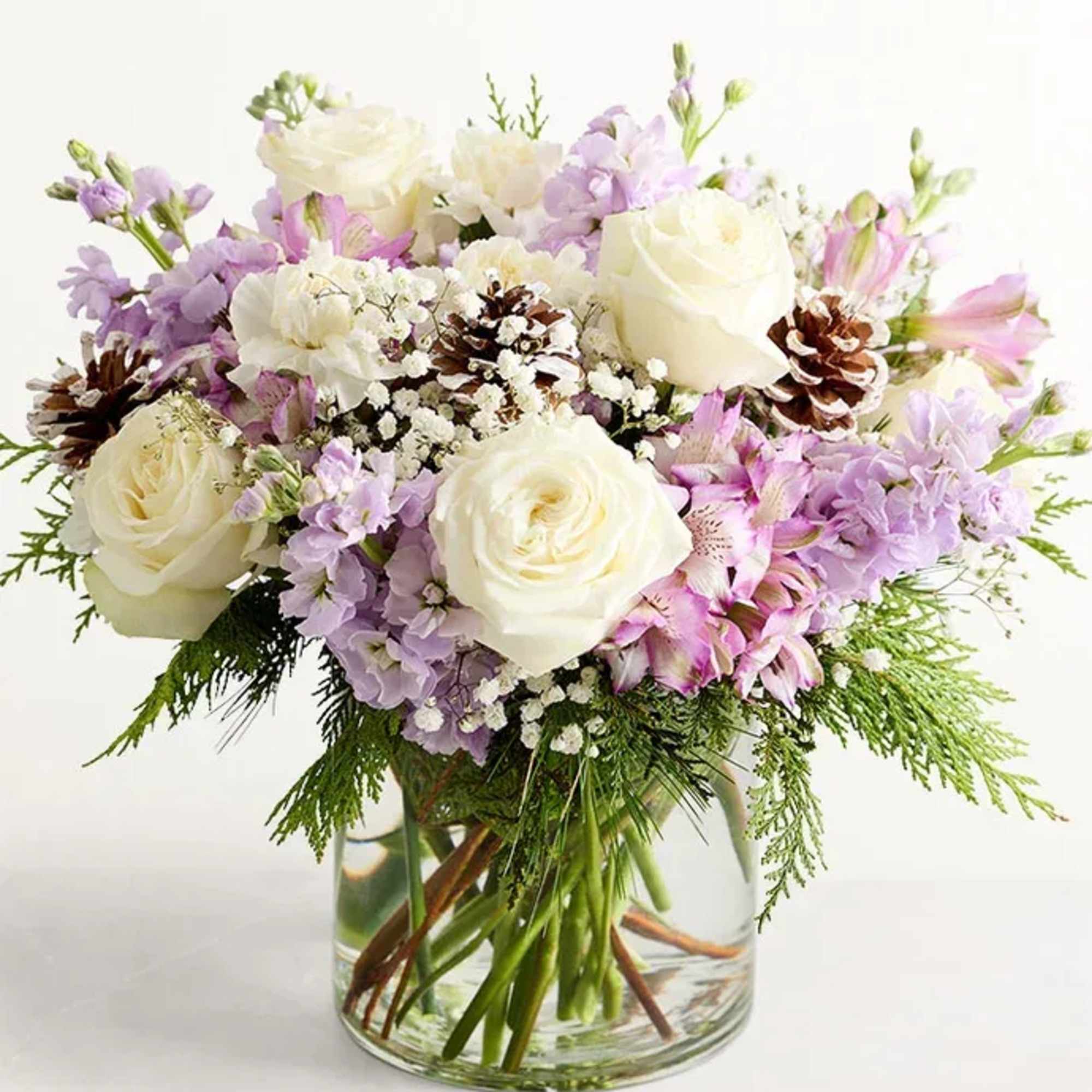 All-around arrangement with white roses and carnations; lavender Peruvian lilies (alstroemeria) and