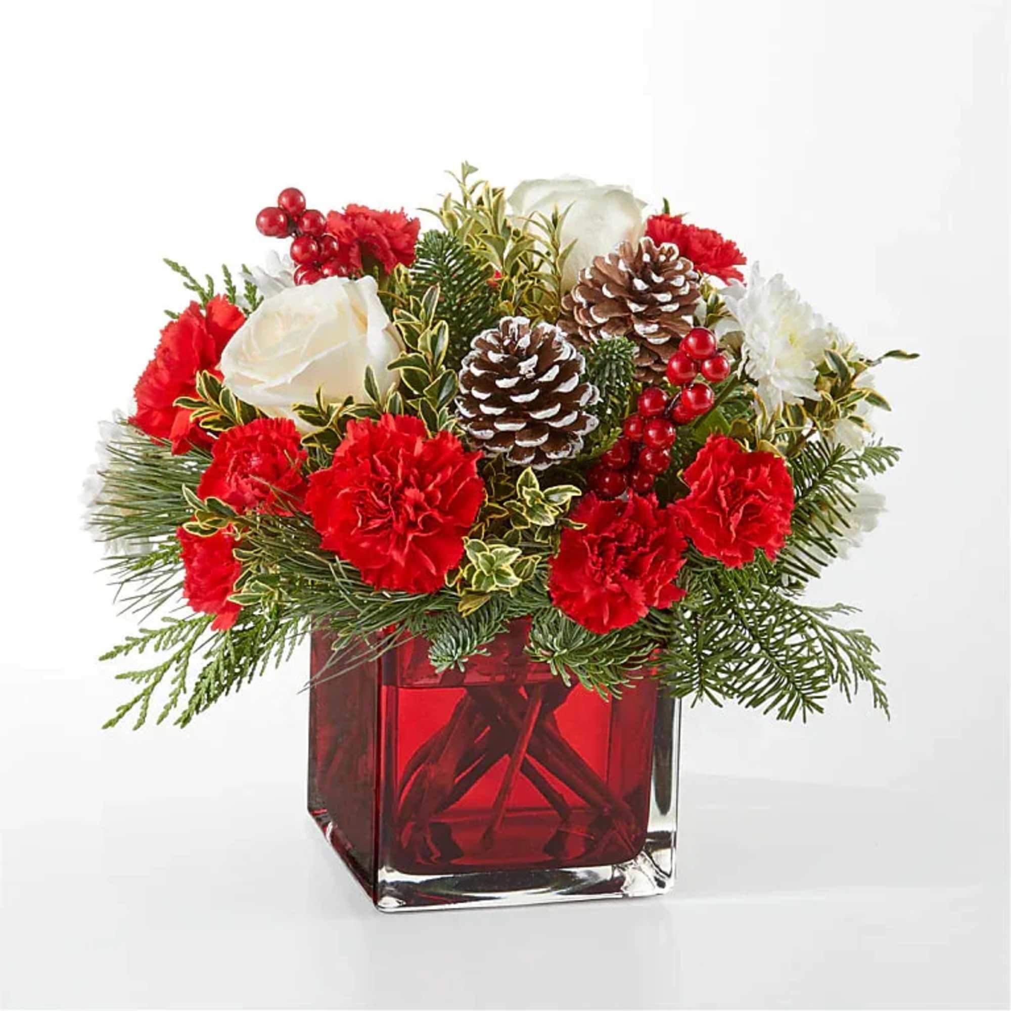 An aromatic experiece, the Winter Pines Bouquet includes assorted seasonal greens to