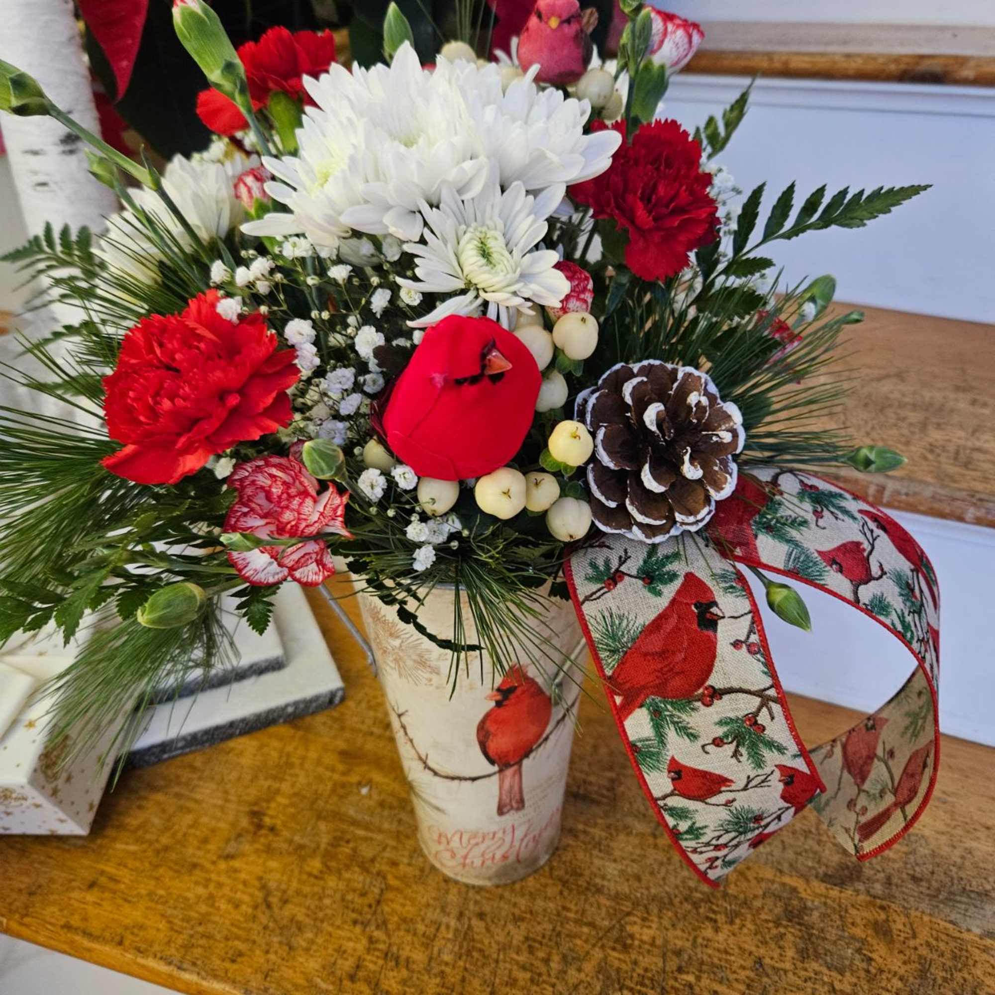 Rustic Cardinal Container Filled with Roses, Carnations, Crysanthimums, Balsam, Pine, Cedar, Pine