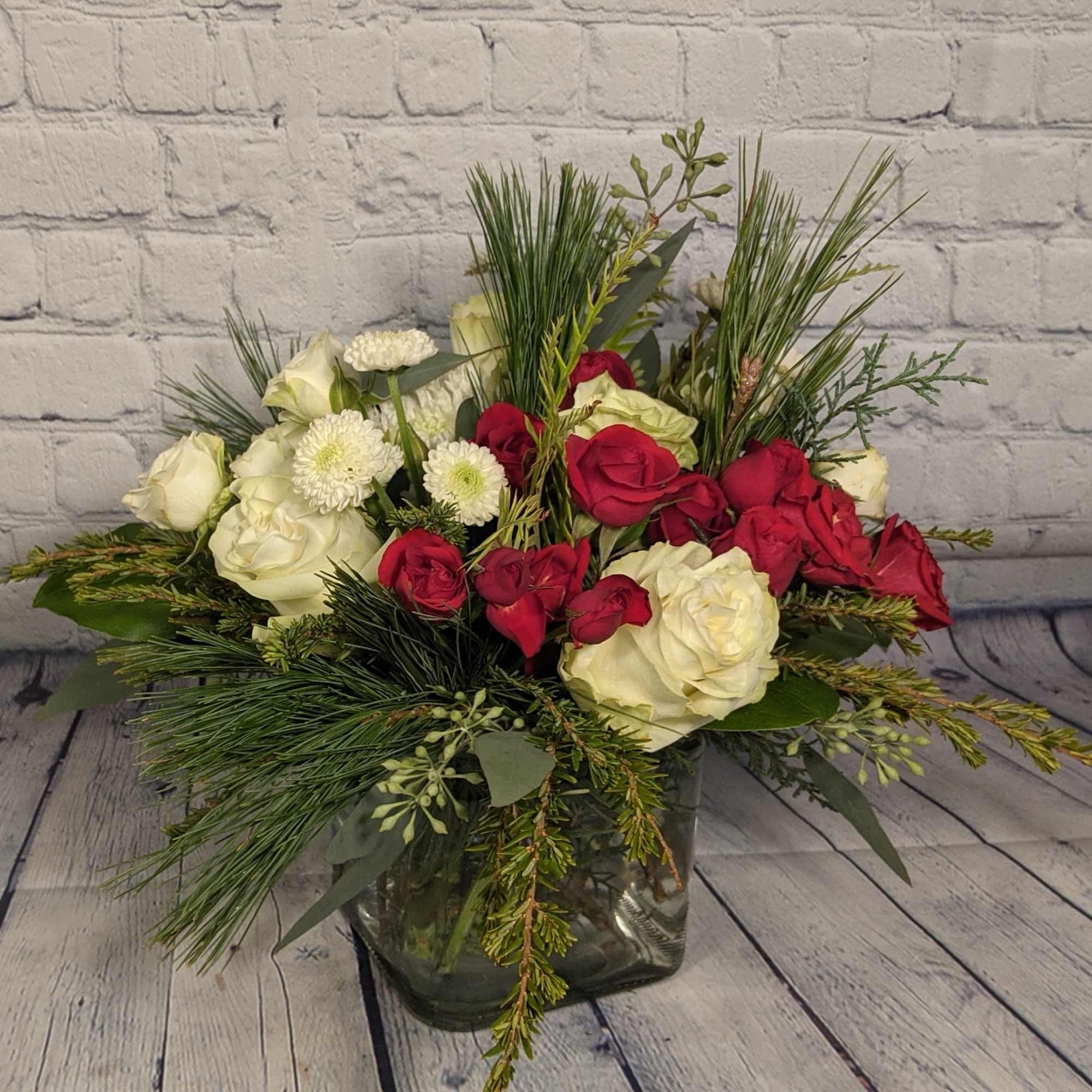 A mix of the season&#039;s best roses and spray roses combine to