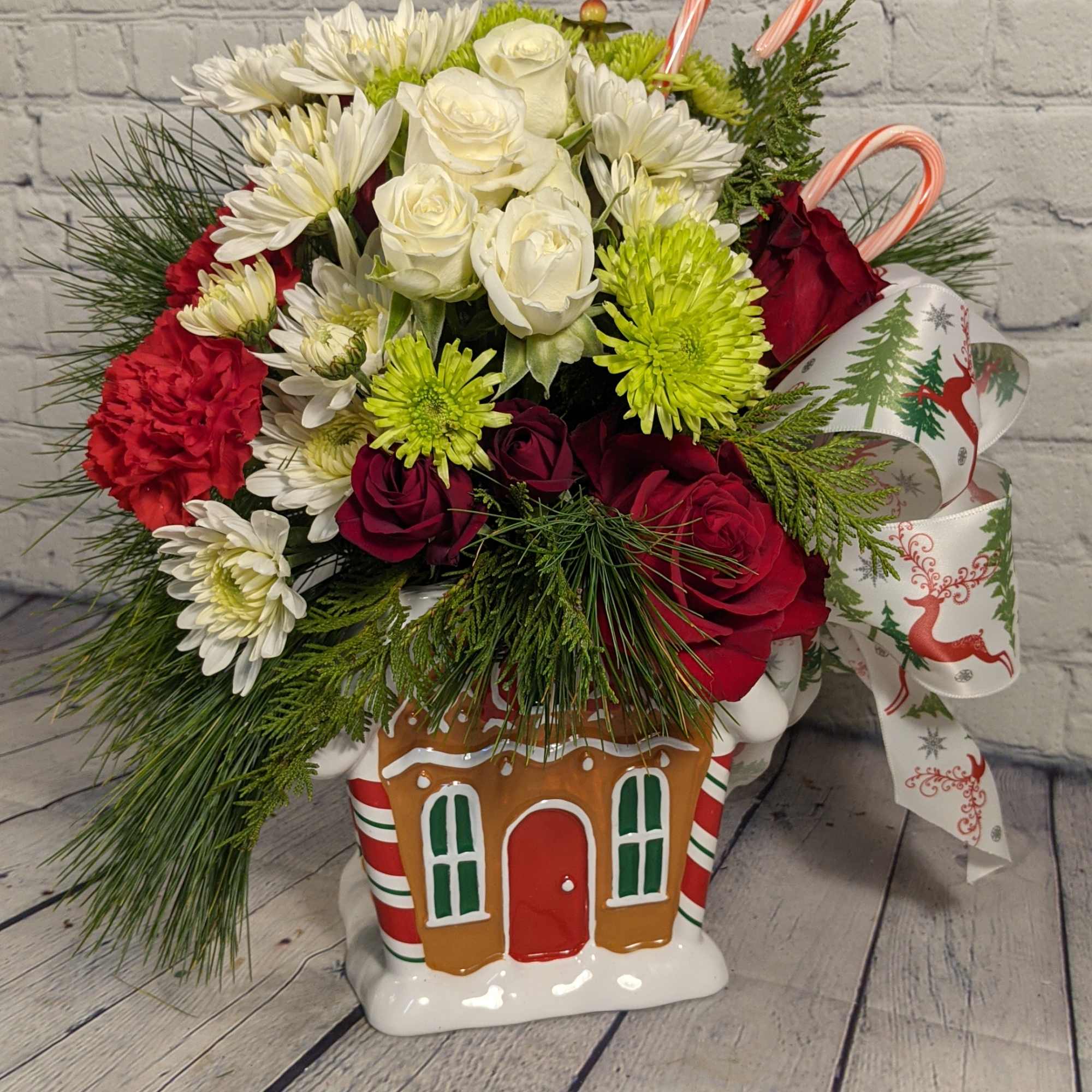 Embrace this Holly Jolly Christmas with red spray roses, chrysanthemums, carnations, hypericum
