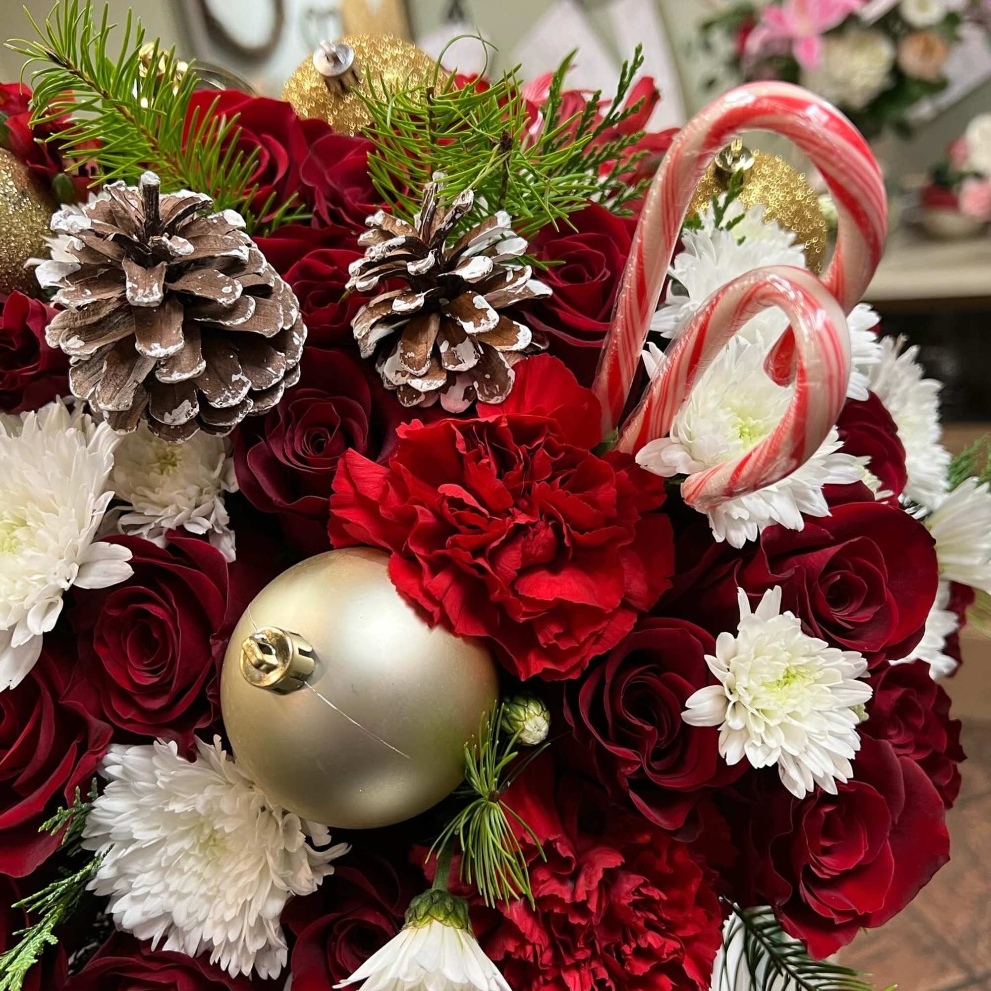 Christmas flower box filled with red roses, carnation, poms, alstomerias, Christmas green