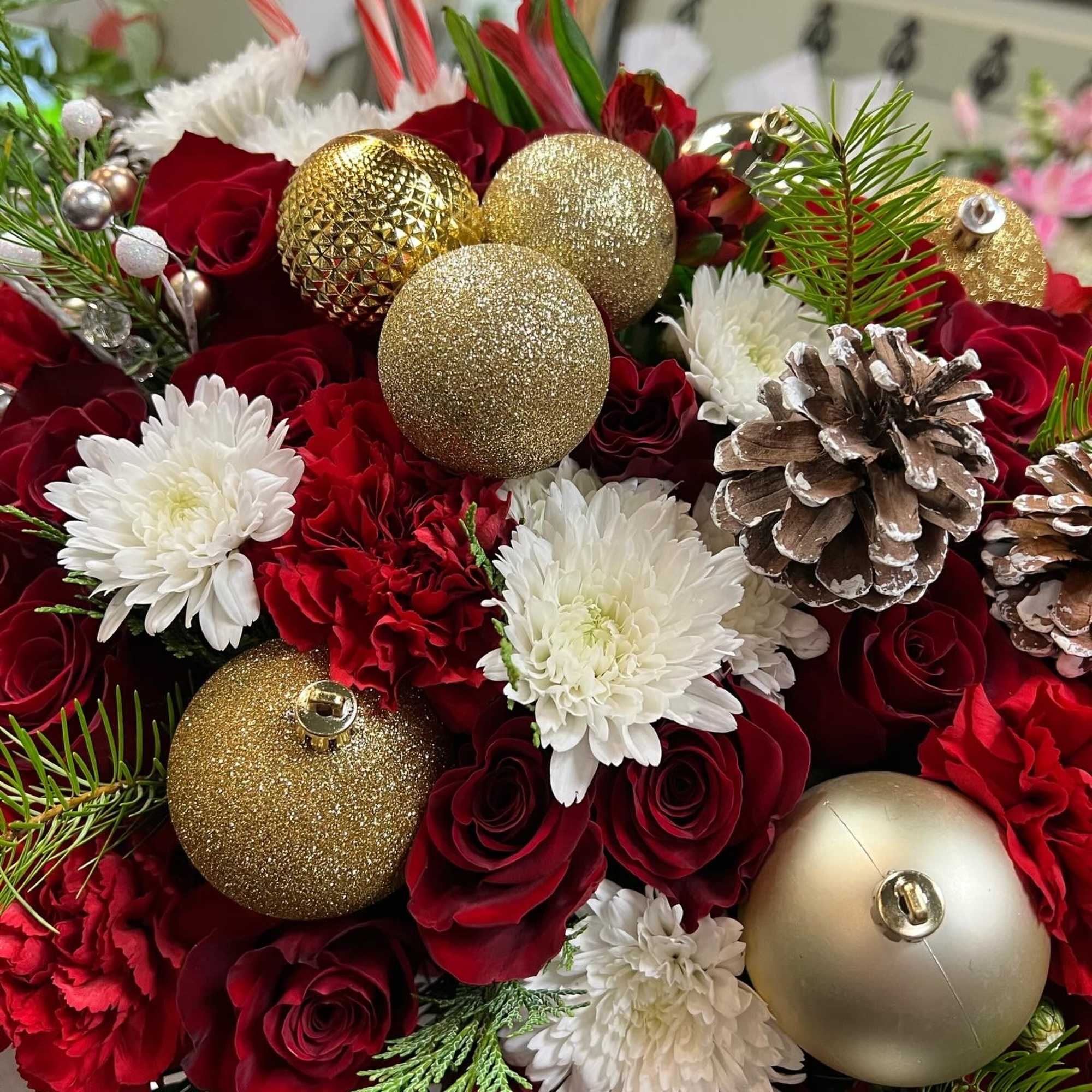 Christmas flower box filled with red roses, carnation, poms, alstomerias, Christmas green