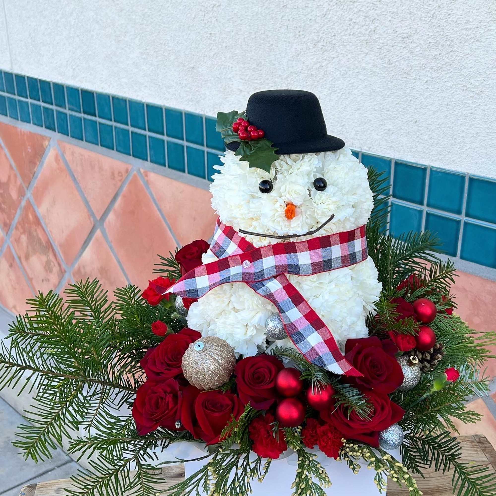 A festive cute and fun flower arrangement for this winter. 