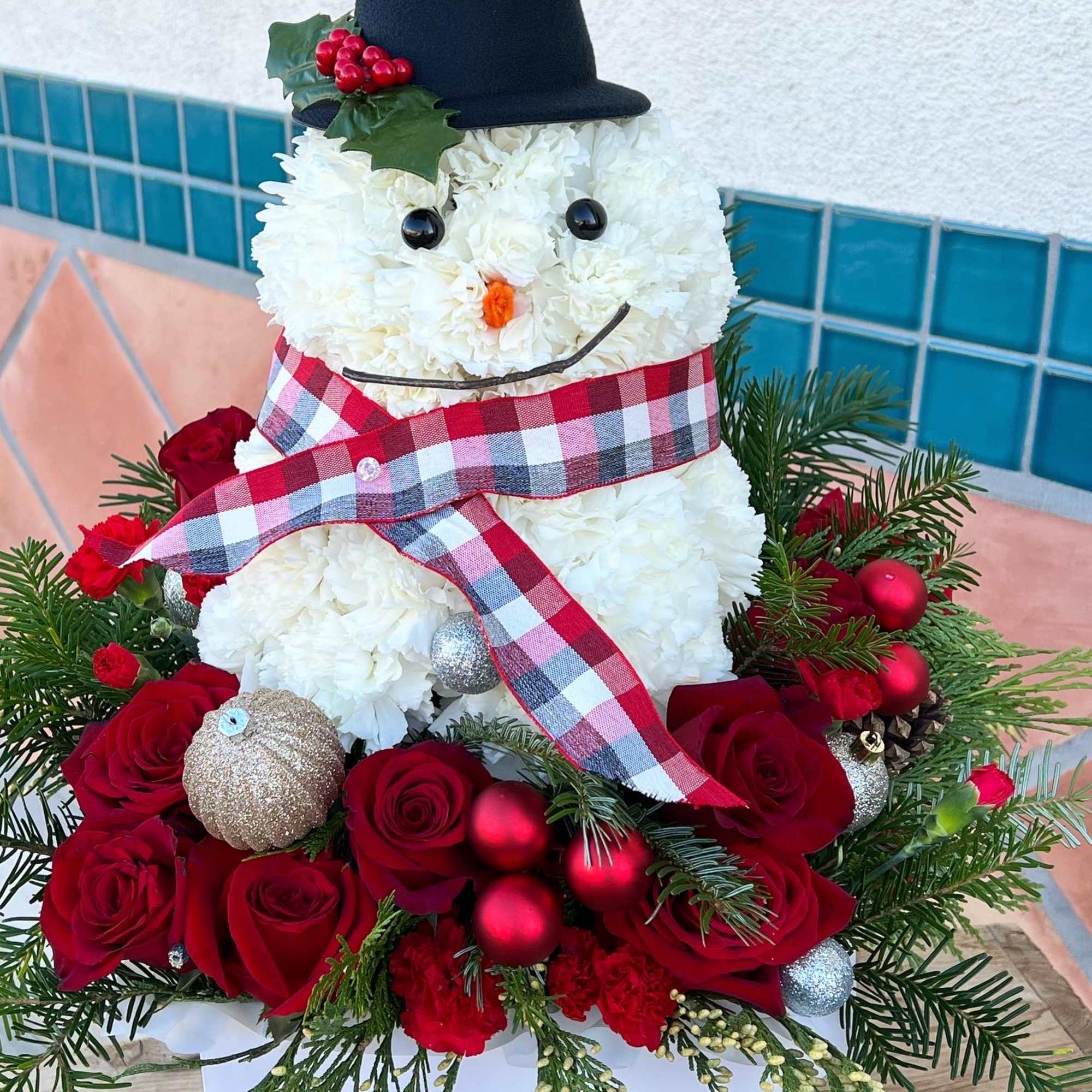 A festive cute and fun flower arrangement for this winter. 