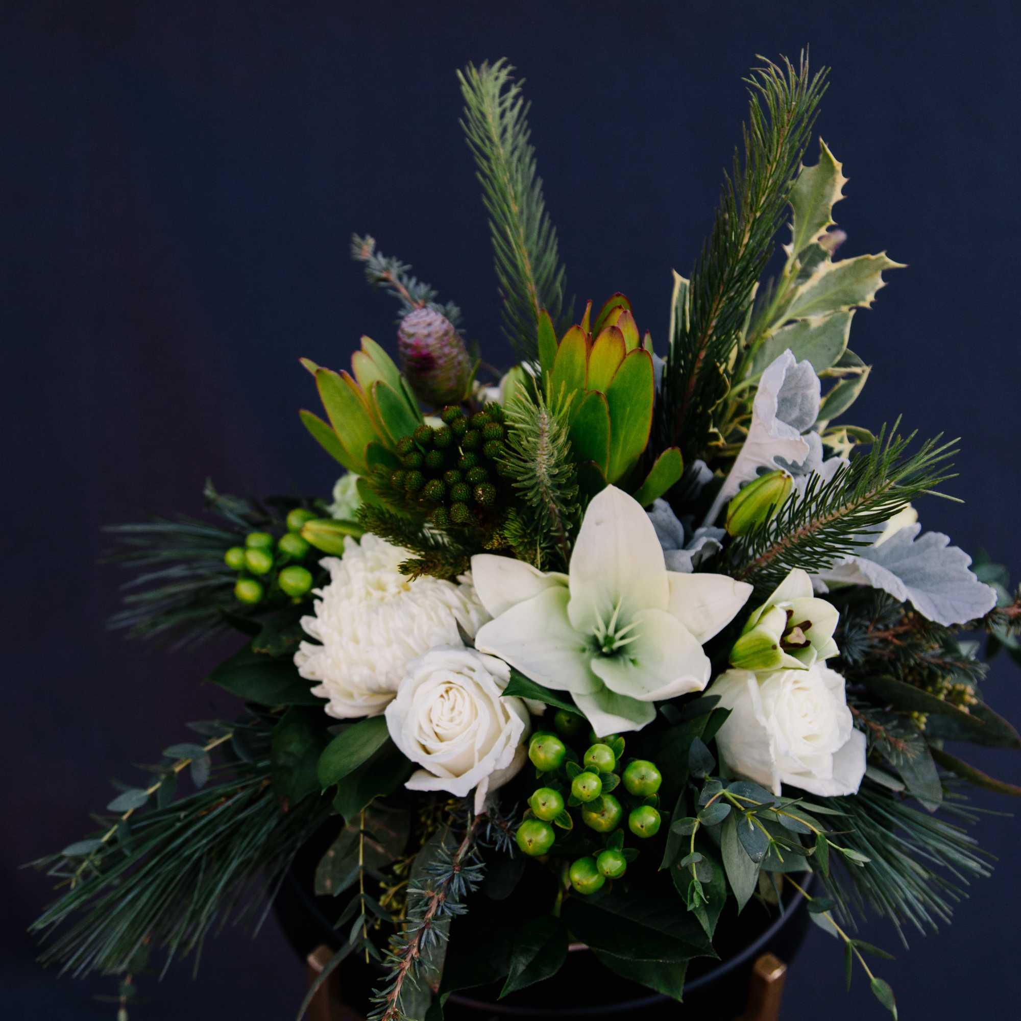 This wintery arrangement will make anyone shiver with delight.  This frosty