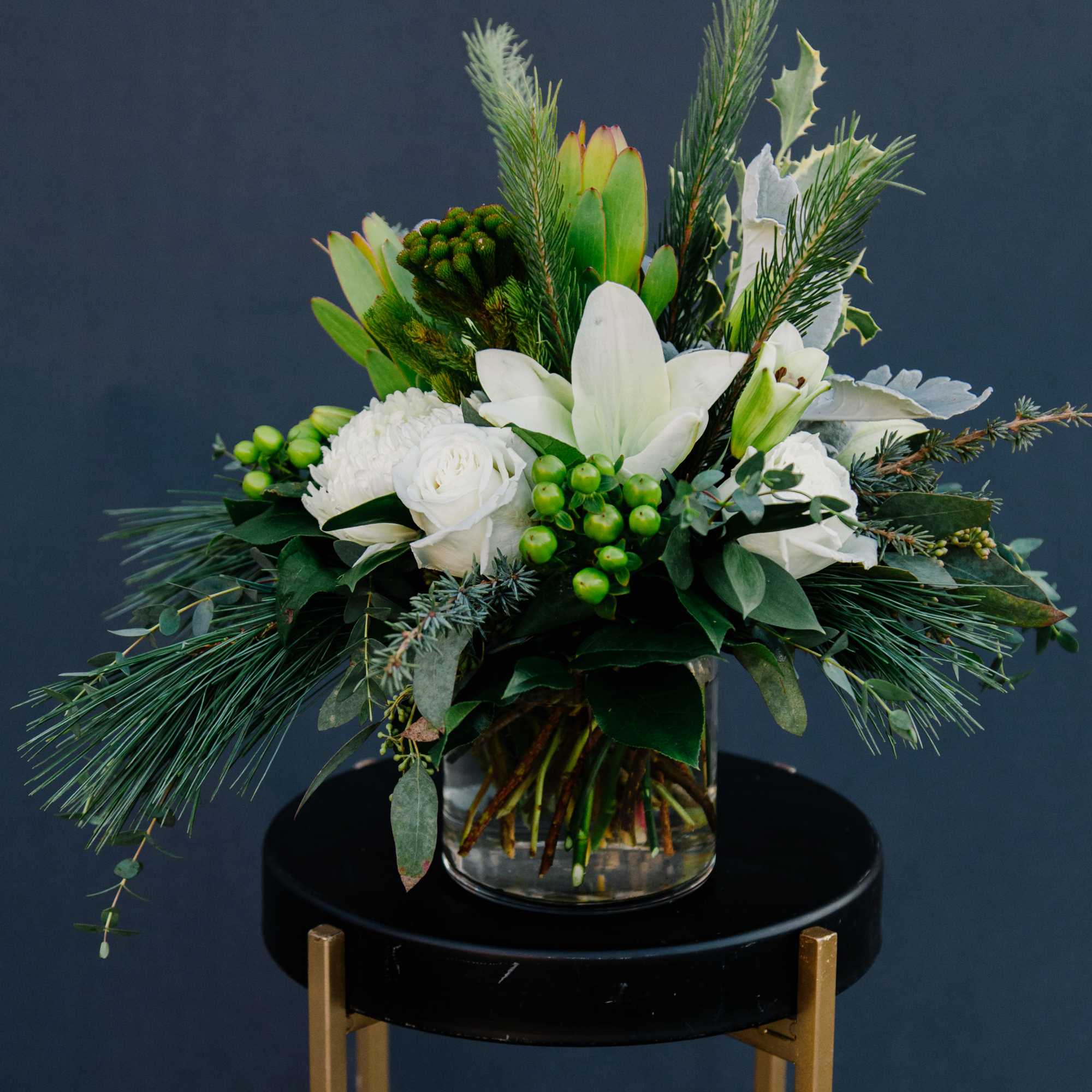 This wintery arrangement will make anyone shiver with delight.  This frosty