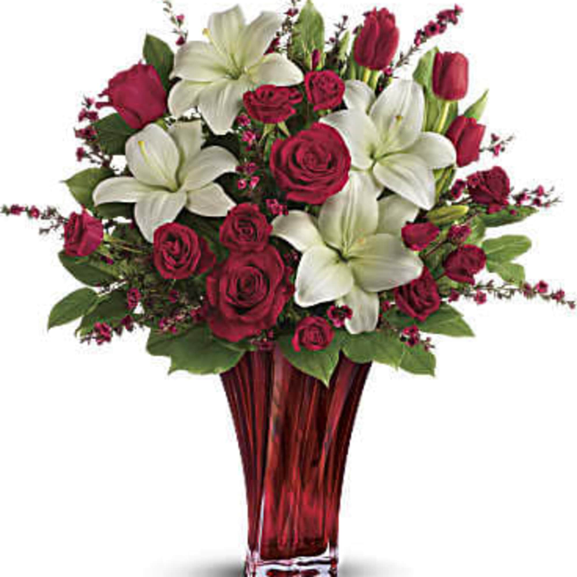 This passionate display of red roses, red spray roses, red tulips, and