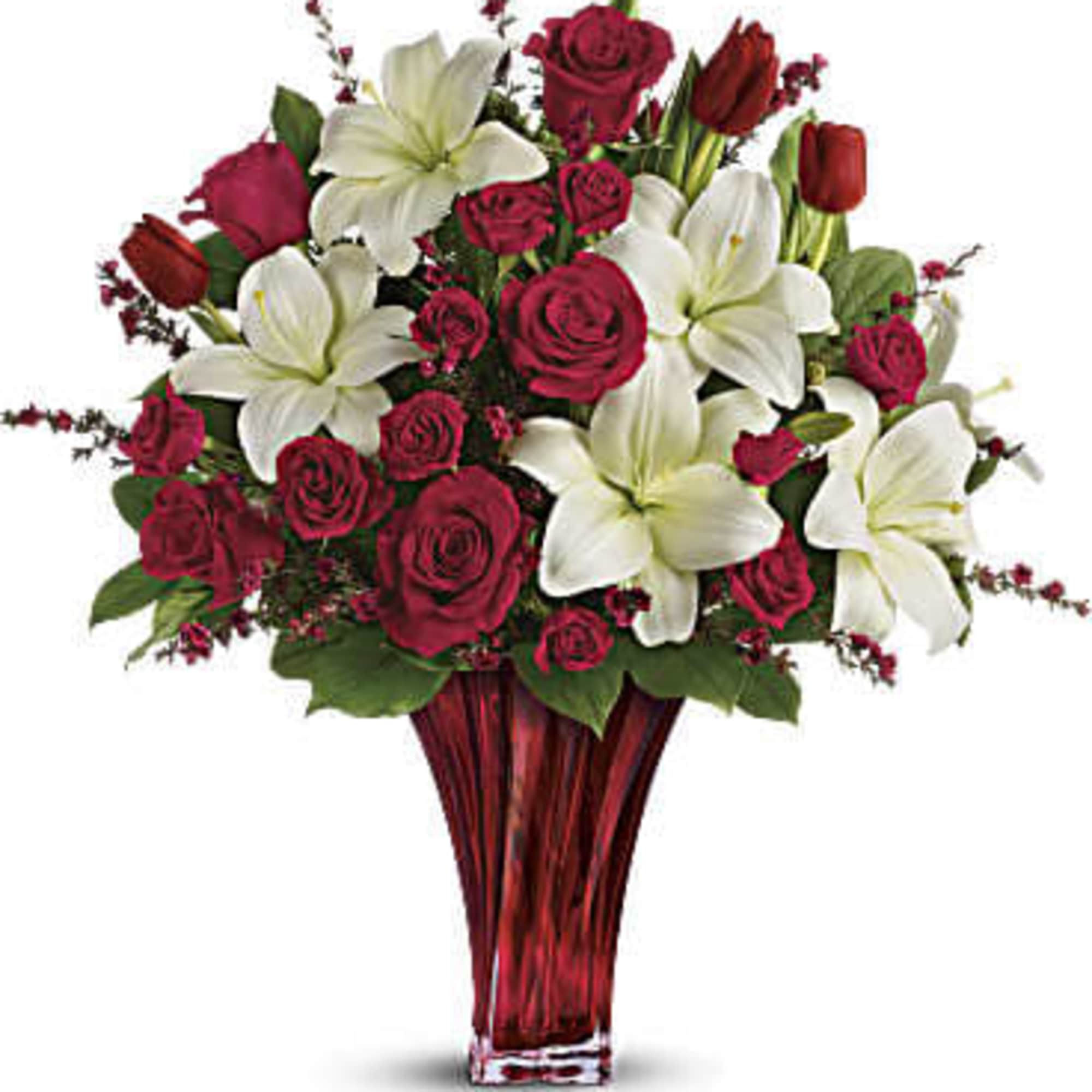 This passionate display of red roses, red spray roses, red tulips, and