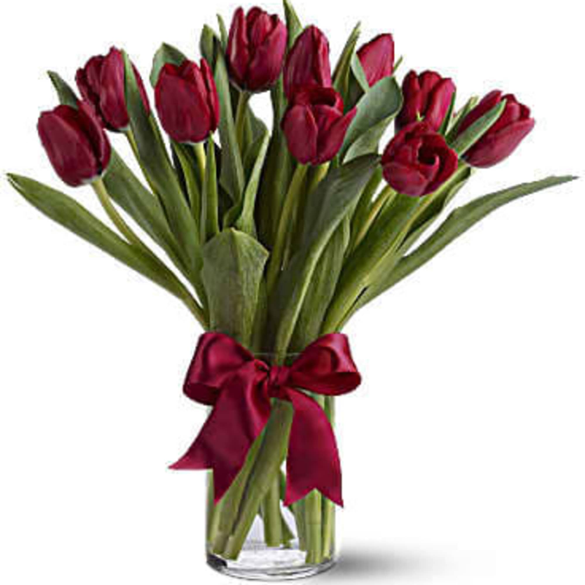 10 ,20 or 30 Tulips arranged in a clear glass vase. You
