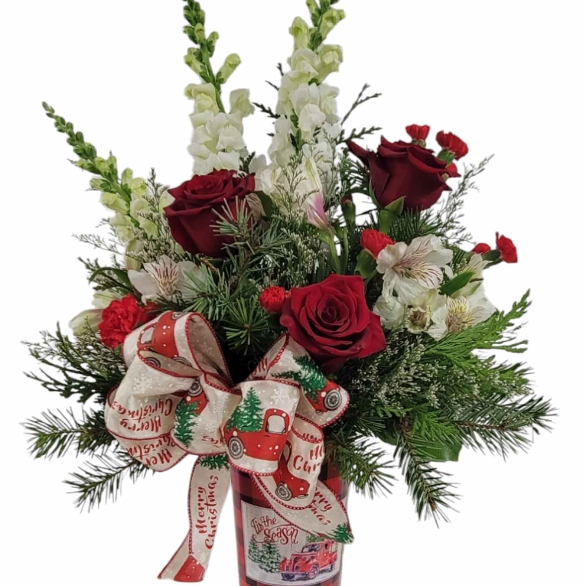 Red and white blooms brought together with evergreens and a holiday bow