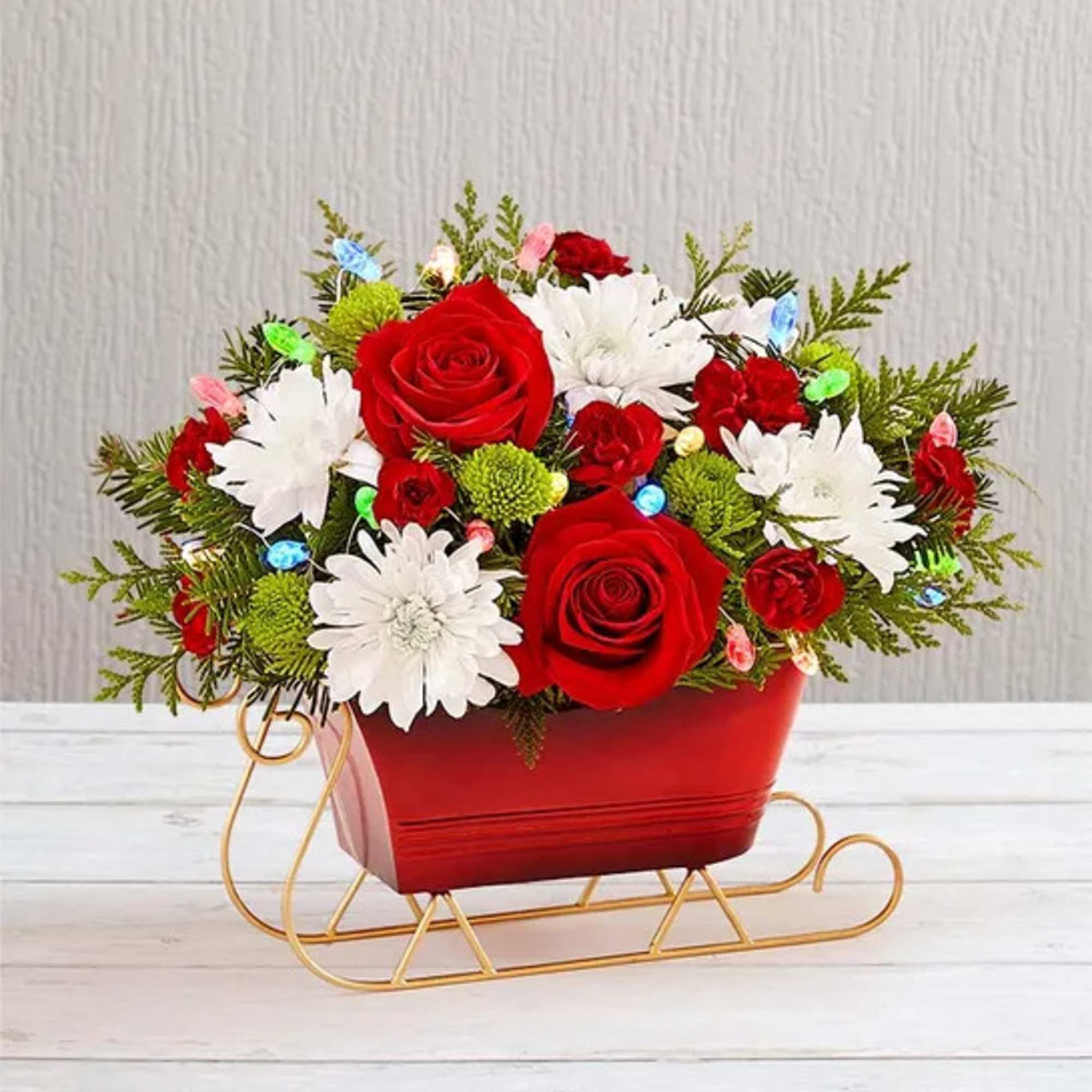 Send holiday joy their way! Our dashing arrangement is filled with classic