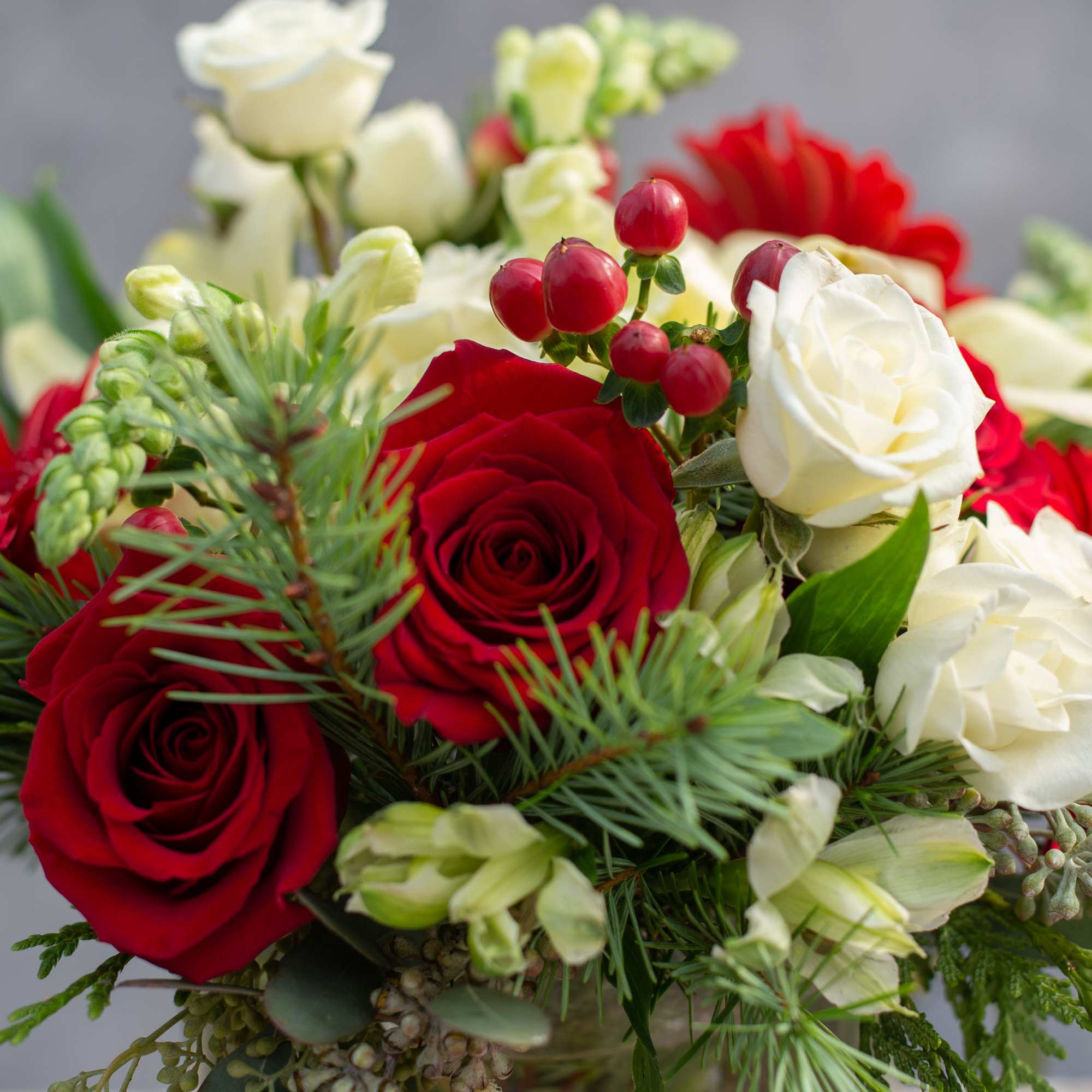 This elegant arrangement is the perfect centerpiece for any holiday table. 