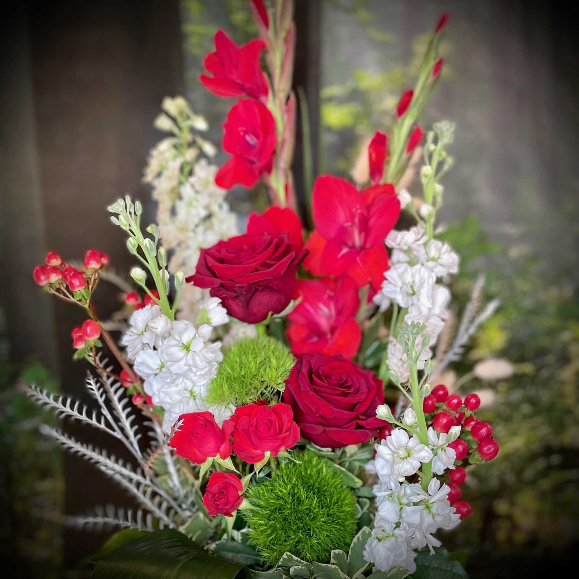 The Winter Ruby is a beautiful arrangement in red and white tones